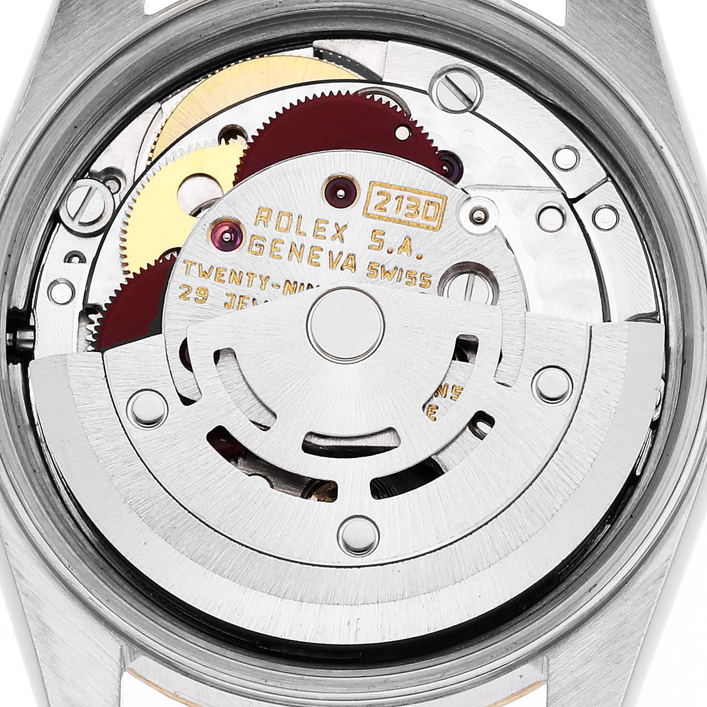 This is a close-up of the internal movement of a Rolex Oyster Perpetual 67193 Women's Steel and Gold (two tone) Champagne Dial 67193 Women's Steel and Gold (two tone) Champagne Dial watch, showing gears and mechanical components.