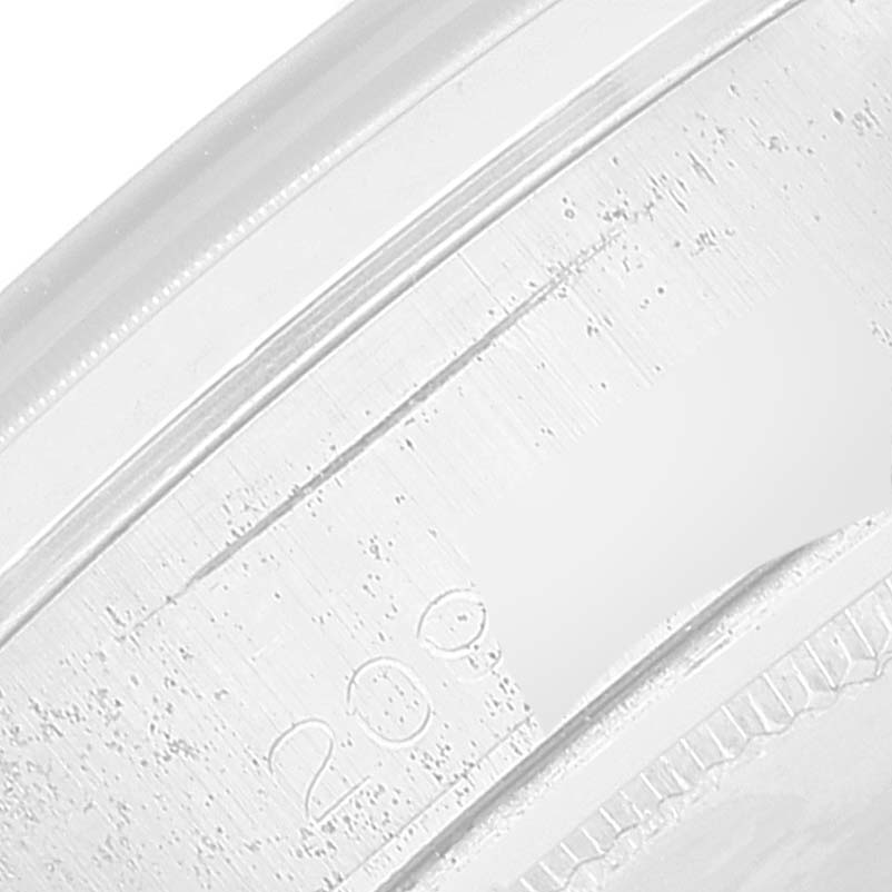 This close-up image shows a detailed side view of the bezel of a Vintage Collection model by Rolex.