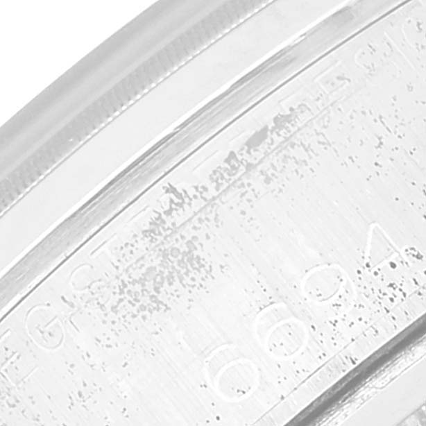 This close-up image shows the engraved serial number on the side of the Vintage Collection Rolex watch case.