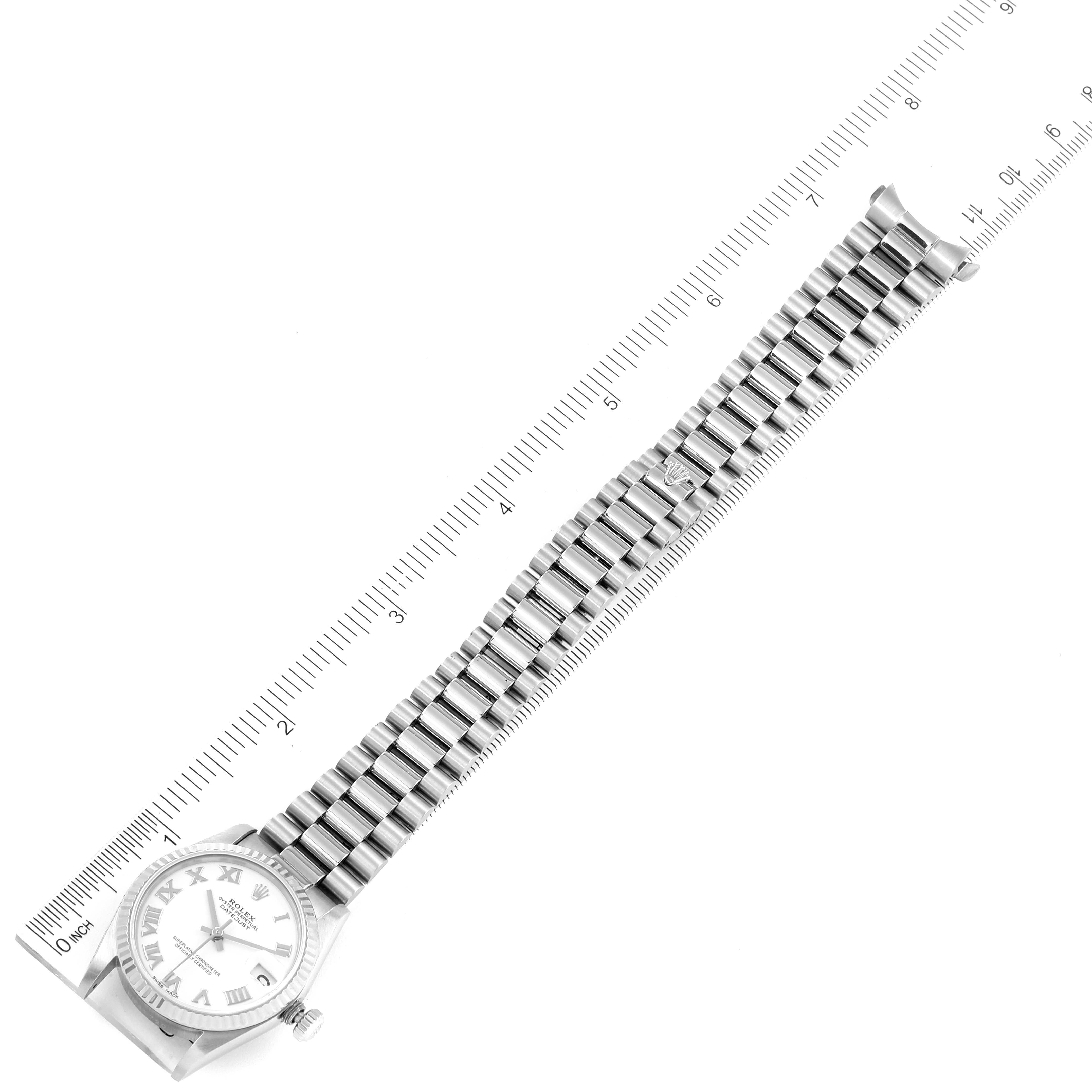 The image shows a top-down view of a Rolex President 68279 Women's White Gold White Dial 68279 Women's White Gold White Dial model watch, including the face, bracelet, and measurement ruler.