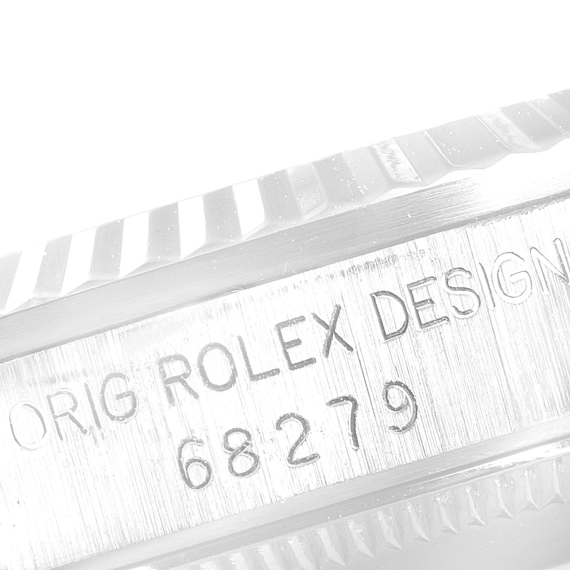 This image shows the side view of the bezel and serial number engraving on a Rolex President 68279 Women's White Gold White Dial 68279 Women's White Gold White Dial model watch.
