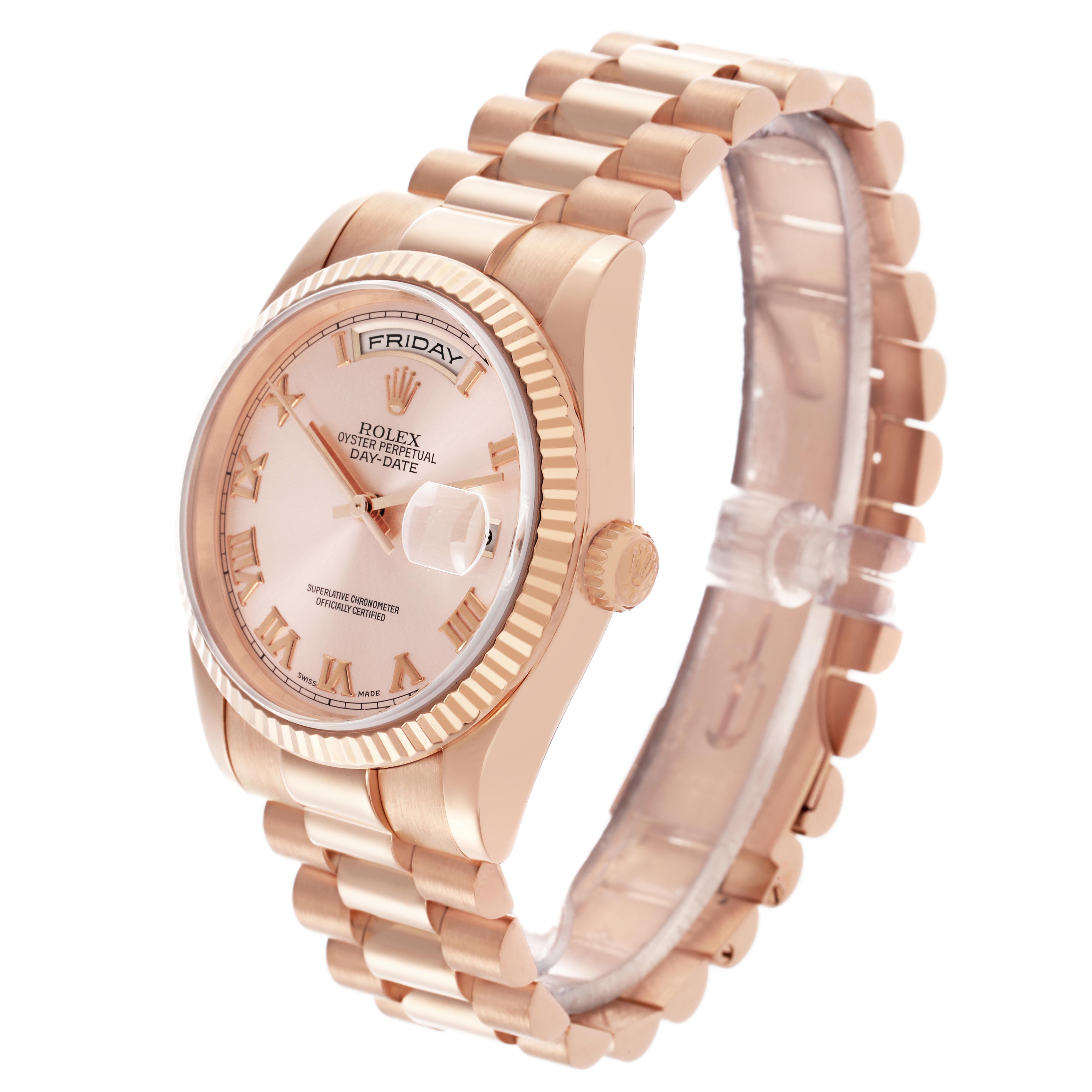The Rolex President 118235 Men's Rose Gold Pink Dial 118235 Men's Rose Gold Pink Dial watch is shown at an angle displaying its face, bezel, crown, and full bracelet.
