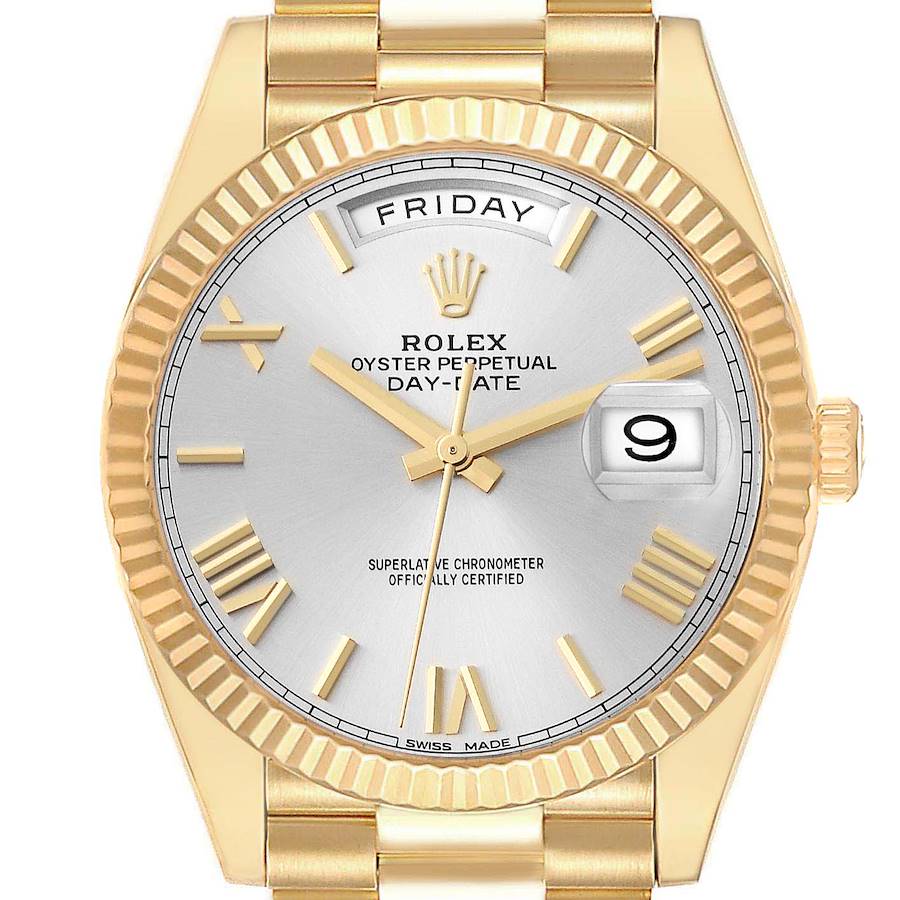 The image shows a front view of a Rolex President model watch, displaying the dial, day, date, and part of the bracelet.