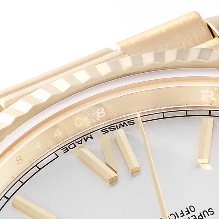 This close-up shows the bezel, partial face, markers, and "Swiss Made" text of a Rolex President 228238 Men
s Yellow Gold Silver Dial 228238 Men
s Yellow Gold Silver Dial watch.