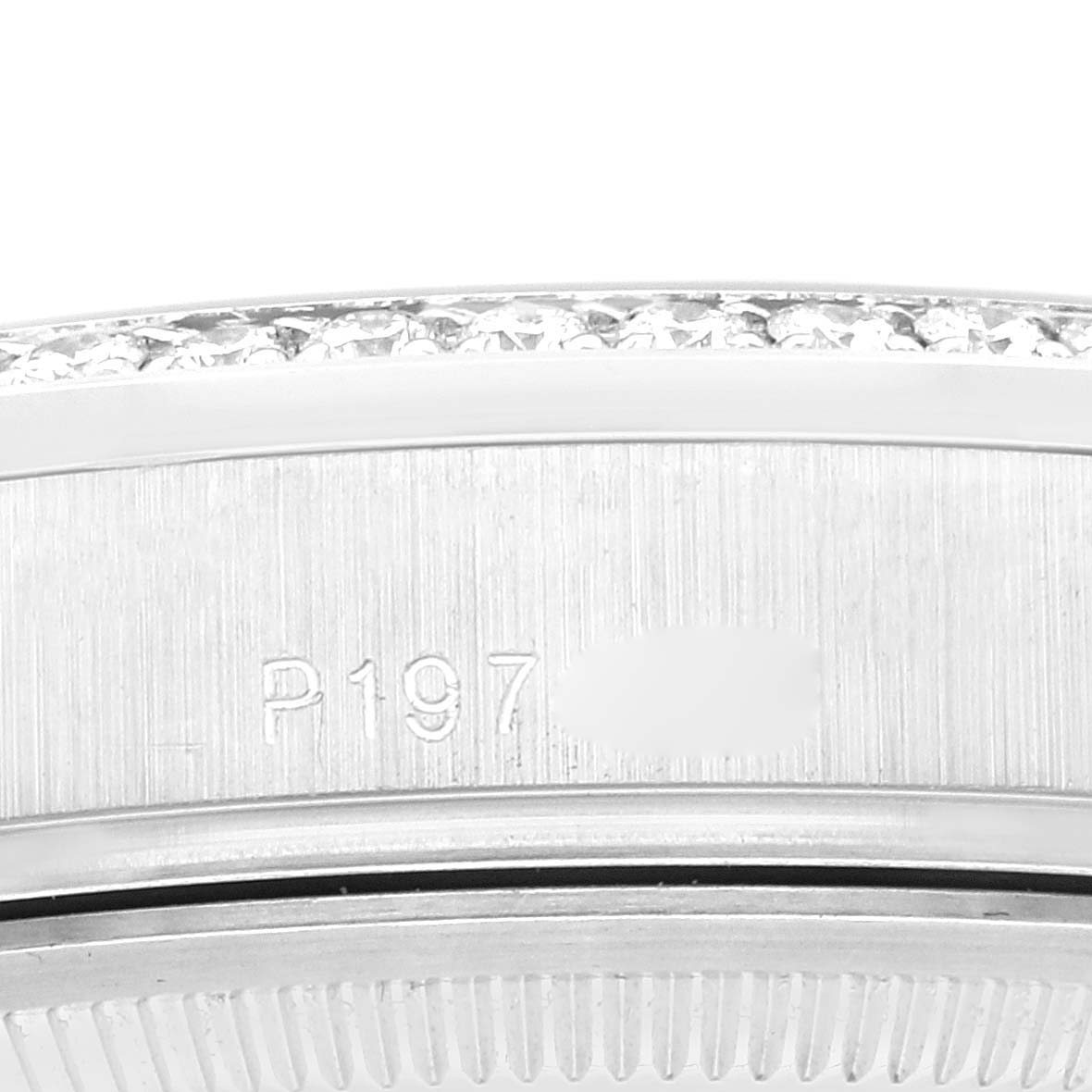 This image shows a close-up of the side of a Rolex President 118346 Men's Platinum Silver Dial 118346 Men's Platinum Silver Dial model watch, featuring part of the case and bezel.
