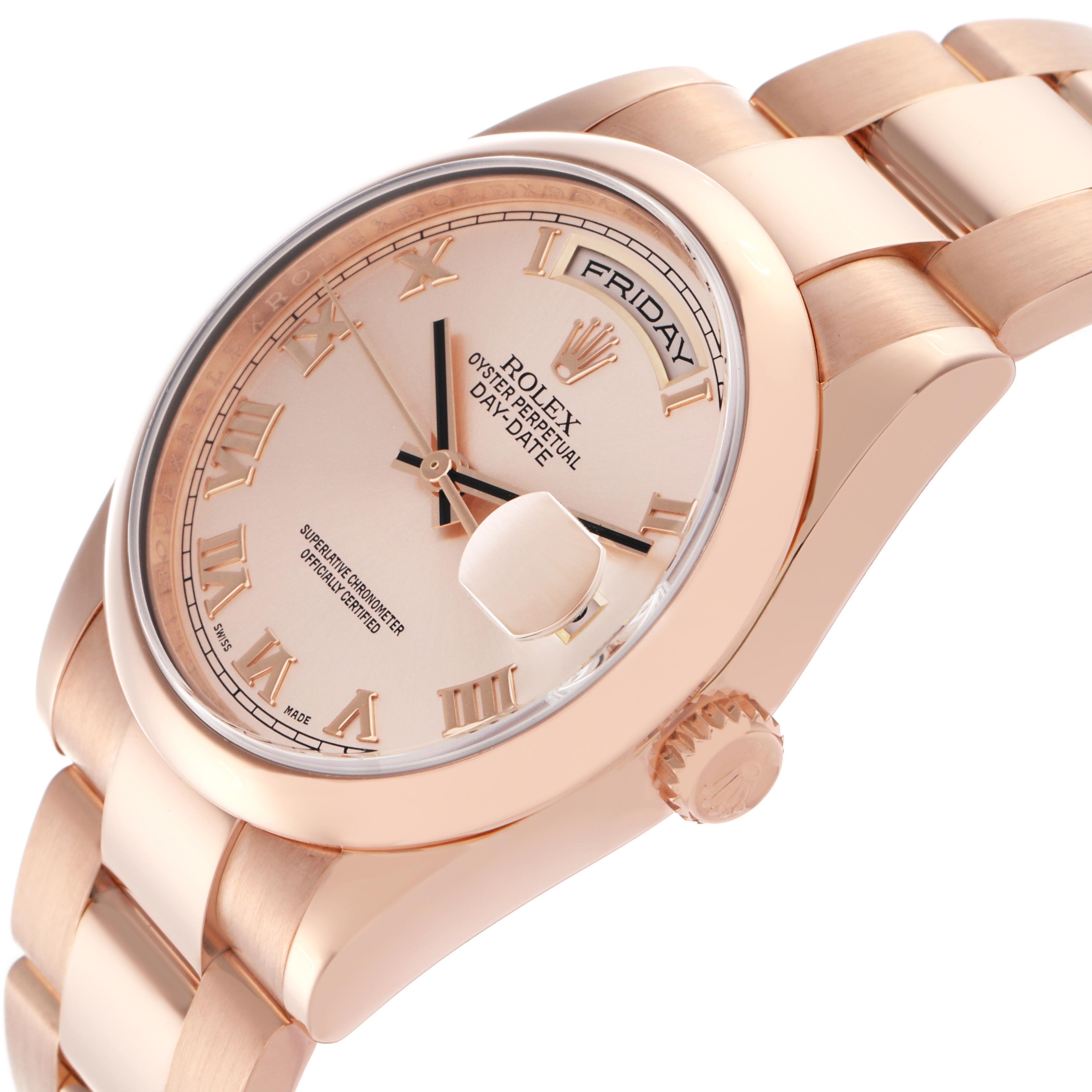 The Rolex President 118205 Men's Rose Gold Pink Dial 118205 Men's Rose Gold Pink Dial model is shown at an angle highlighting the face, day display, crown, and part of the bracelet.