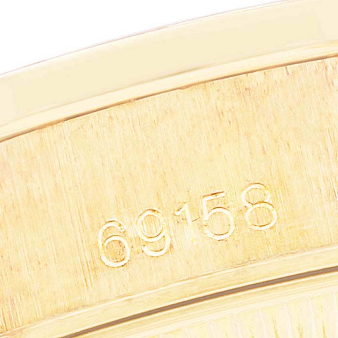 The image shows an angled close-up of the model number "69158" on the case of a Rolex President 69158 Women's Yellow Gold Mother of Pearl Dial 69158 Women's Yellow Gold Mother of Pearl Dial watch.