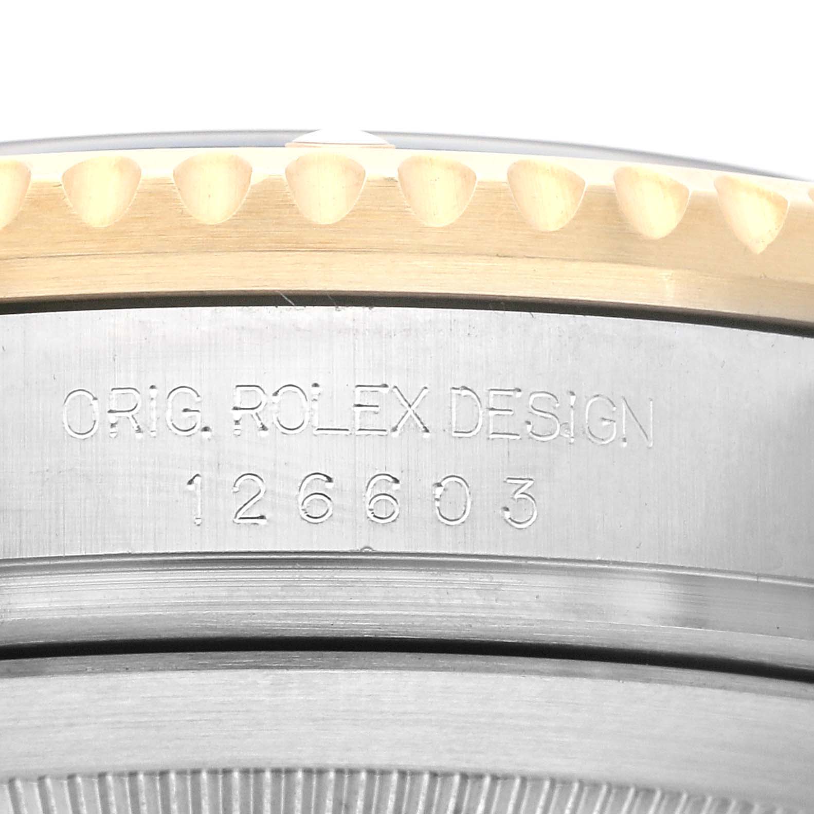 The image shows a close-up of the engraved bezel and design number of the Rolex Sea-Dweller 126603 Men's Steel and Gold (two tone) Black Dial 126603 Men's Steel and Gold (two tone) Black Dial model 126603.
