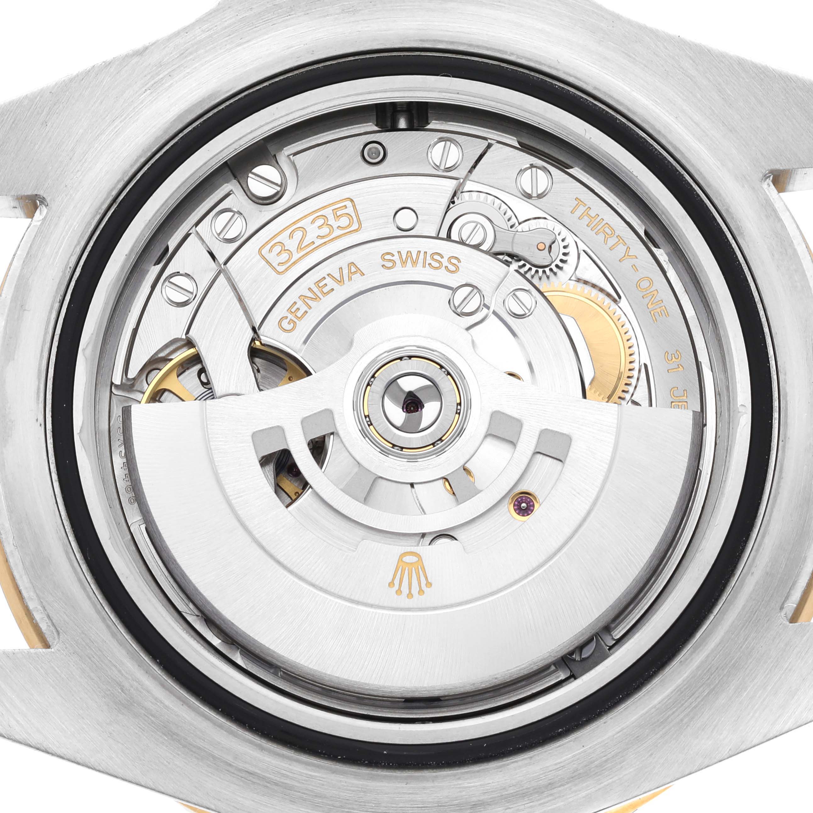 This image shows the open case back of a Rolex Sea-Dweller 126603 Men's Steel and Gold (two tone) Black Dial 126603 Men's Steel and Gold (two tone) Black Dial watch, revealing its intricate movement.