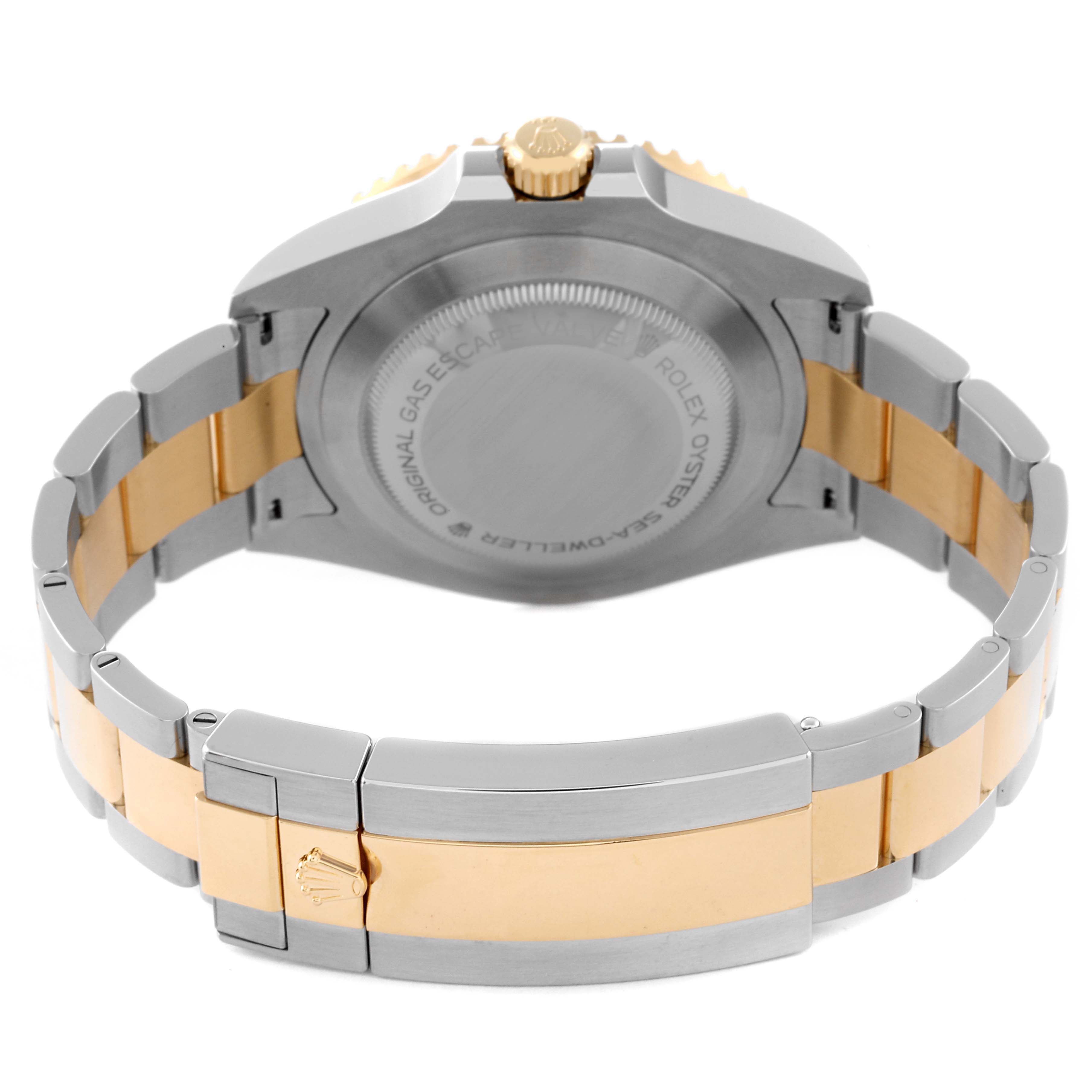 This image shows the back view of a Rolex Sea-Dweller 126603 Men's Steel and Gold (two tone) Black Dial 126603 Men's Steel and Gold (two tone) Black Dial watch, highlighting the case back, crown, and two-tone bracelet.