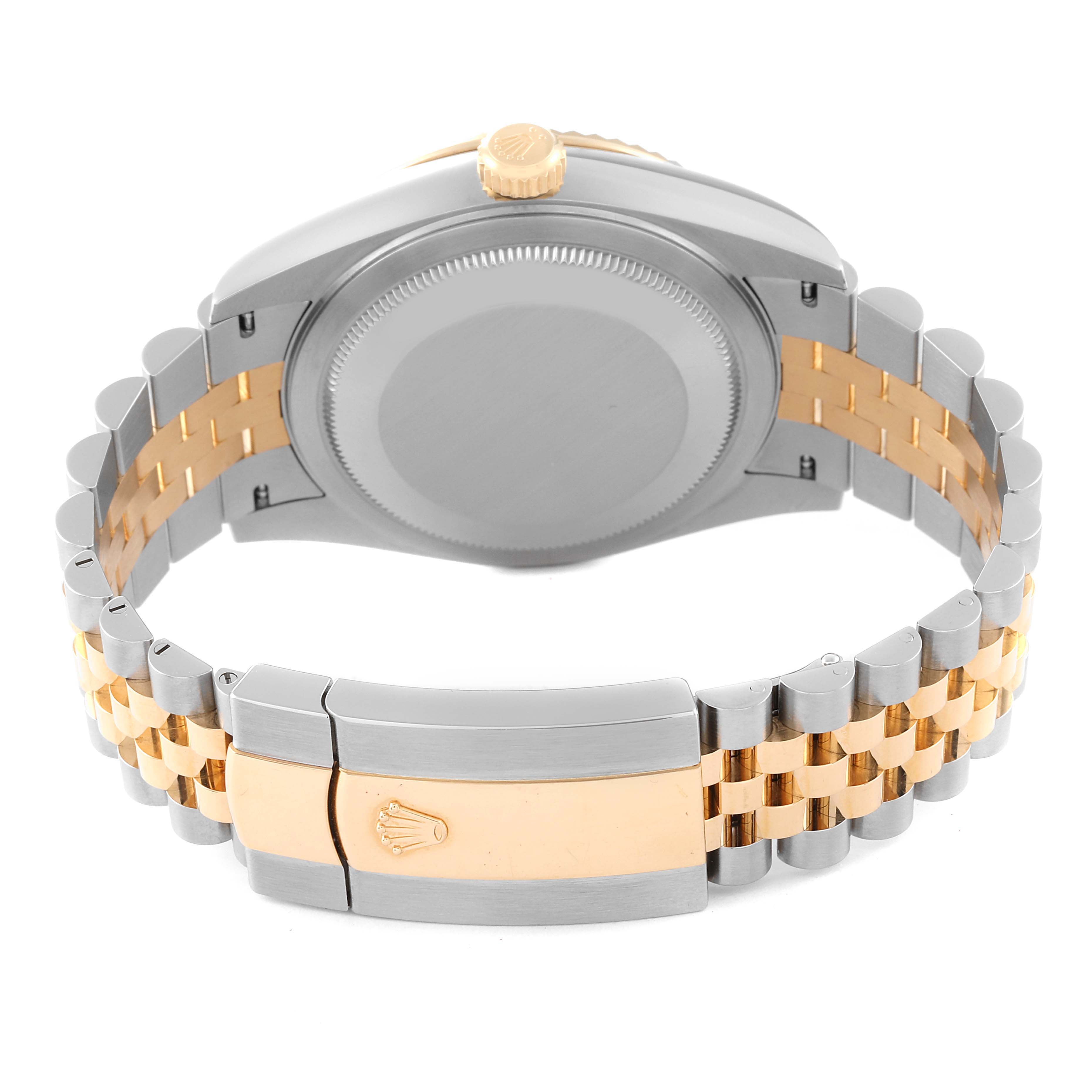 The image shows the back of a Rolex Sky-Dweller 326933 Men
s Steel and Gold (two tone) Black Dial 326933 Men
s Steel and Gold (two tone) Black Dial watch focusing on the case back and a two-tone bracelet with the clasp visible.