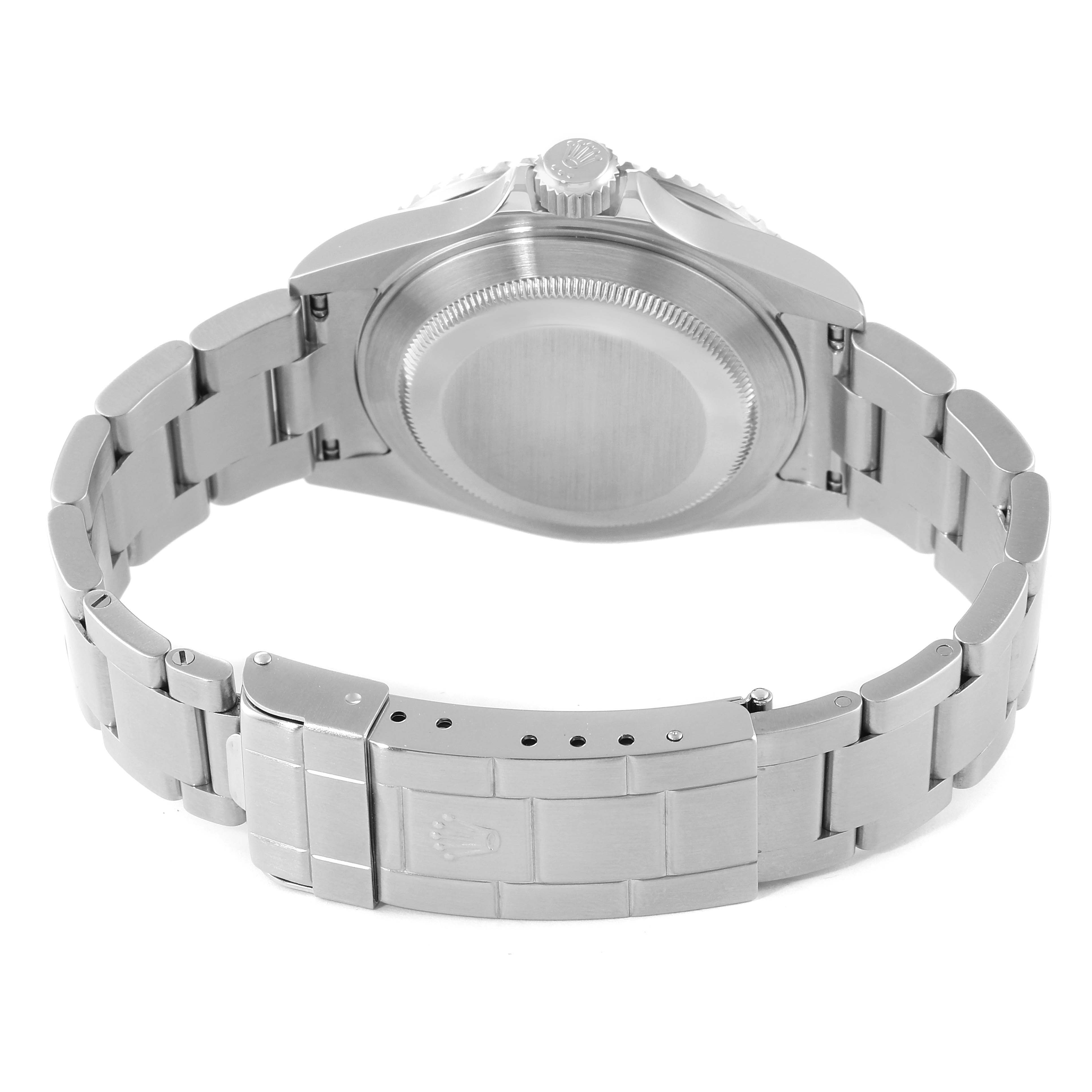 The image shows the back angle of a Rolex Submariner 16610 Men
s Stainless Steel Black Dial 16610 Men
s Stainless Steel Black Dial watch, highlighting its case back and bracelet.