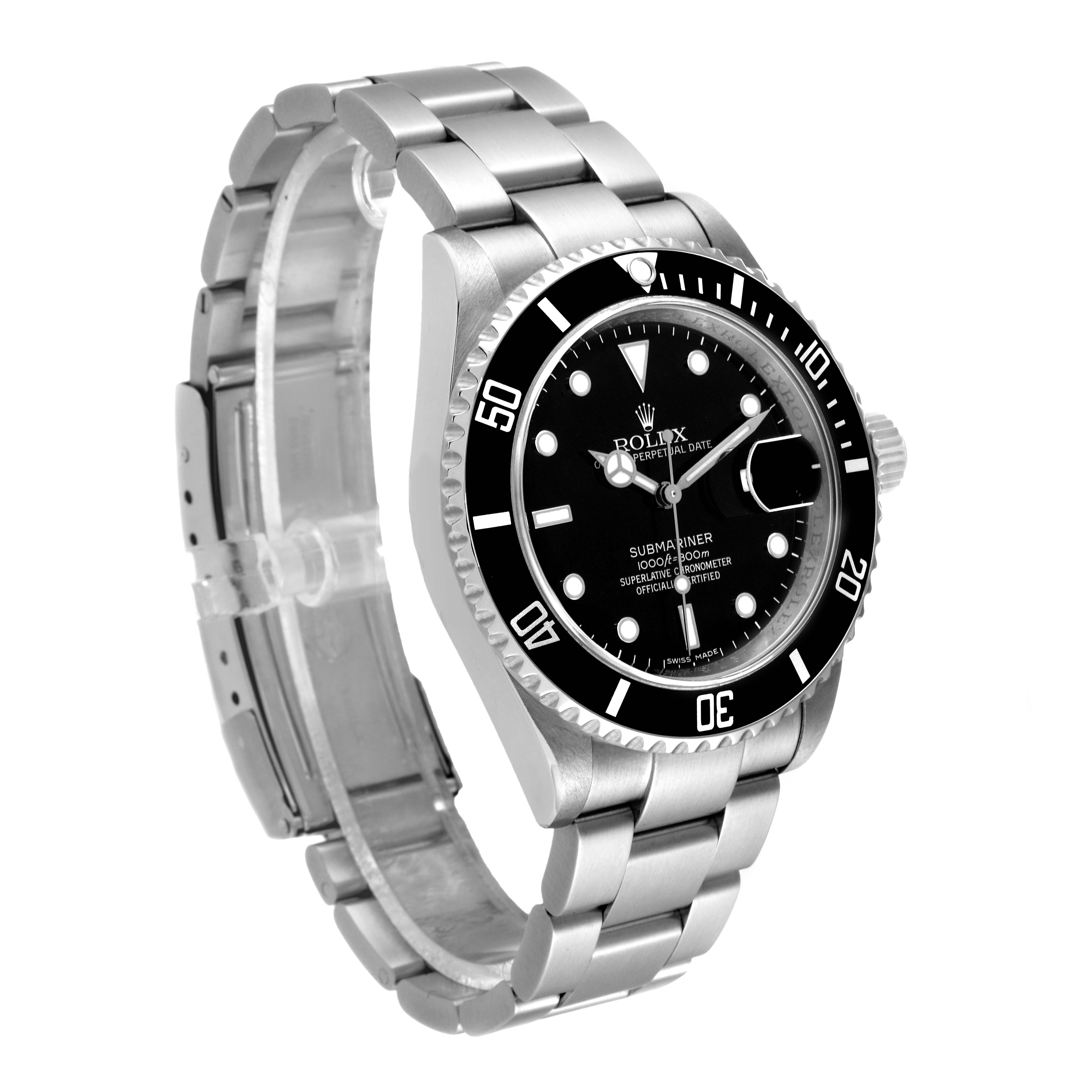 The Rolex Submariner 16610 Men
s Stainless Steel Black Dial 16610 Men
s Stainless Steel Black Dial watch is shown from a front angle, highlighting its face, bezel, bracelet, and clasp.