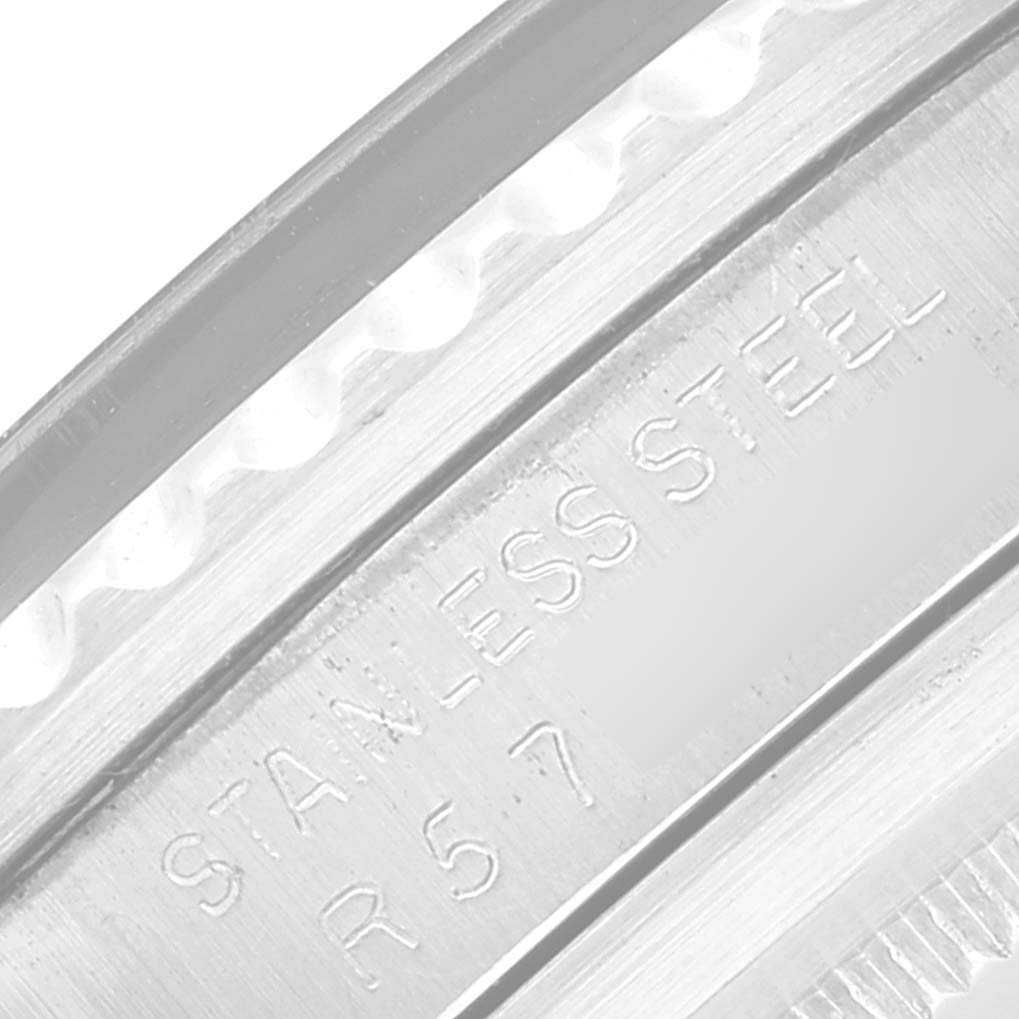 The image shows a close-up of the engraving on the stainless steel case of a Rolex Submariner 5513 Men
s Stainless Steel Black Dial 5513 Men
s Stainless Steel Black Dial watch.