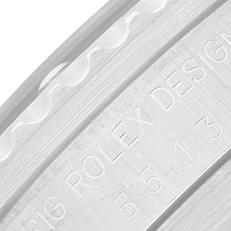 The image shows a close-up of the engraved case back and part of the bezel of a Rolex Submariner 5513 Men
s Stainless Steel Black Dial 5513 Men
s Stainless Steel Black Dial watch.