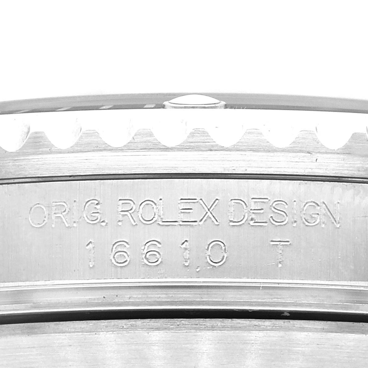 The image shows a close-up of the side of the Rolex Submariner 16610 Men's Stainless Steel Black Dial 16610 Men's Stainless Steel Black Dial watch case, focusing on the engraved model number 16610T.