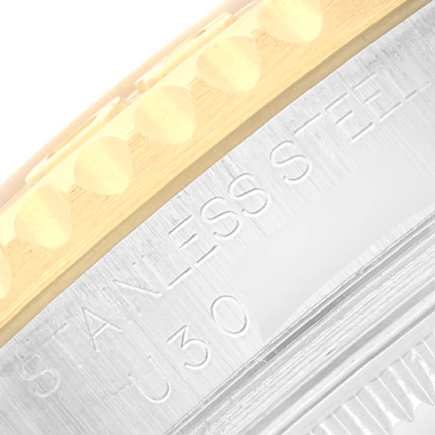 This close-up angle shows the edge of the bezel and part of the caseback of the Rolex Yacht-Master 68623 Men's Steel and Gold (two tone) Grey Dial 68623 Men's Steel and Gold (two tone) Grey Dial watch.