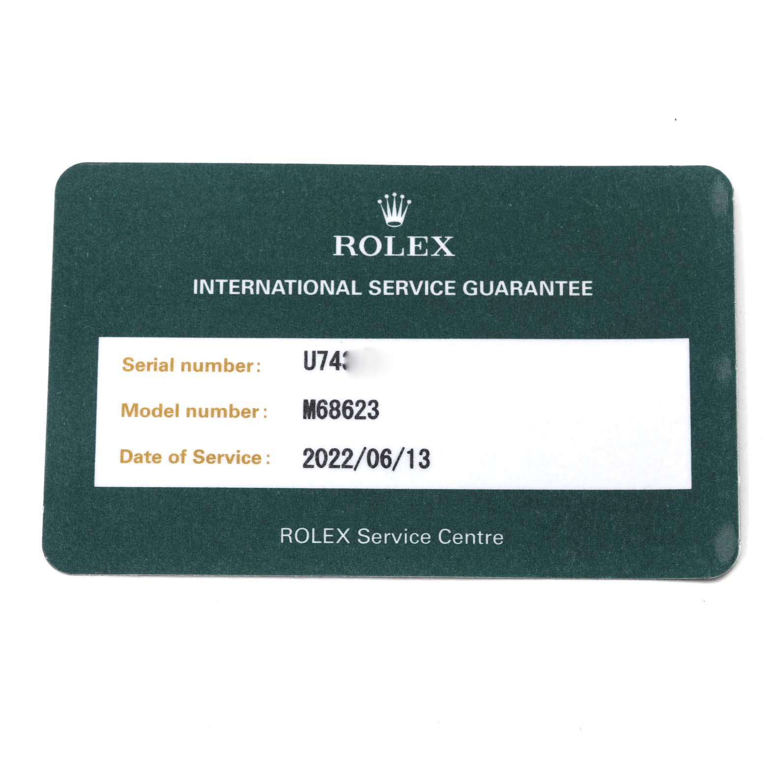 The image shows a warranty card for the Yacht-Master model by Rolex, displaying serial number, model number, and service date.