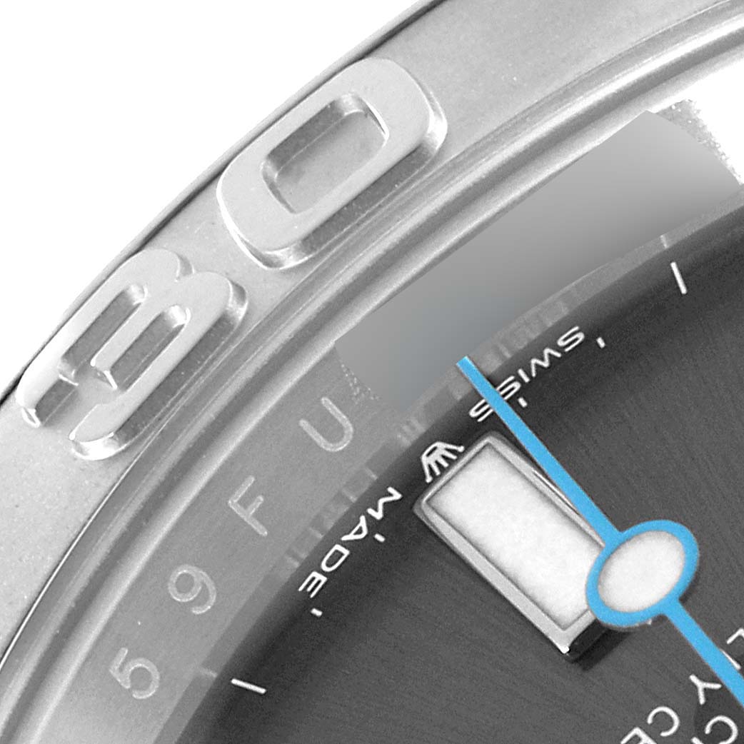 This close-up shot of the Rolex Yacht-Master 126622 Men's Stainless Steel Grey Dial 126622 Men's Stainless Steel Grey Dial watch shows part of the bezel and dial, including the blue second hand and "30" marker.