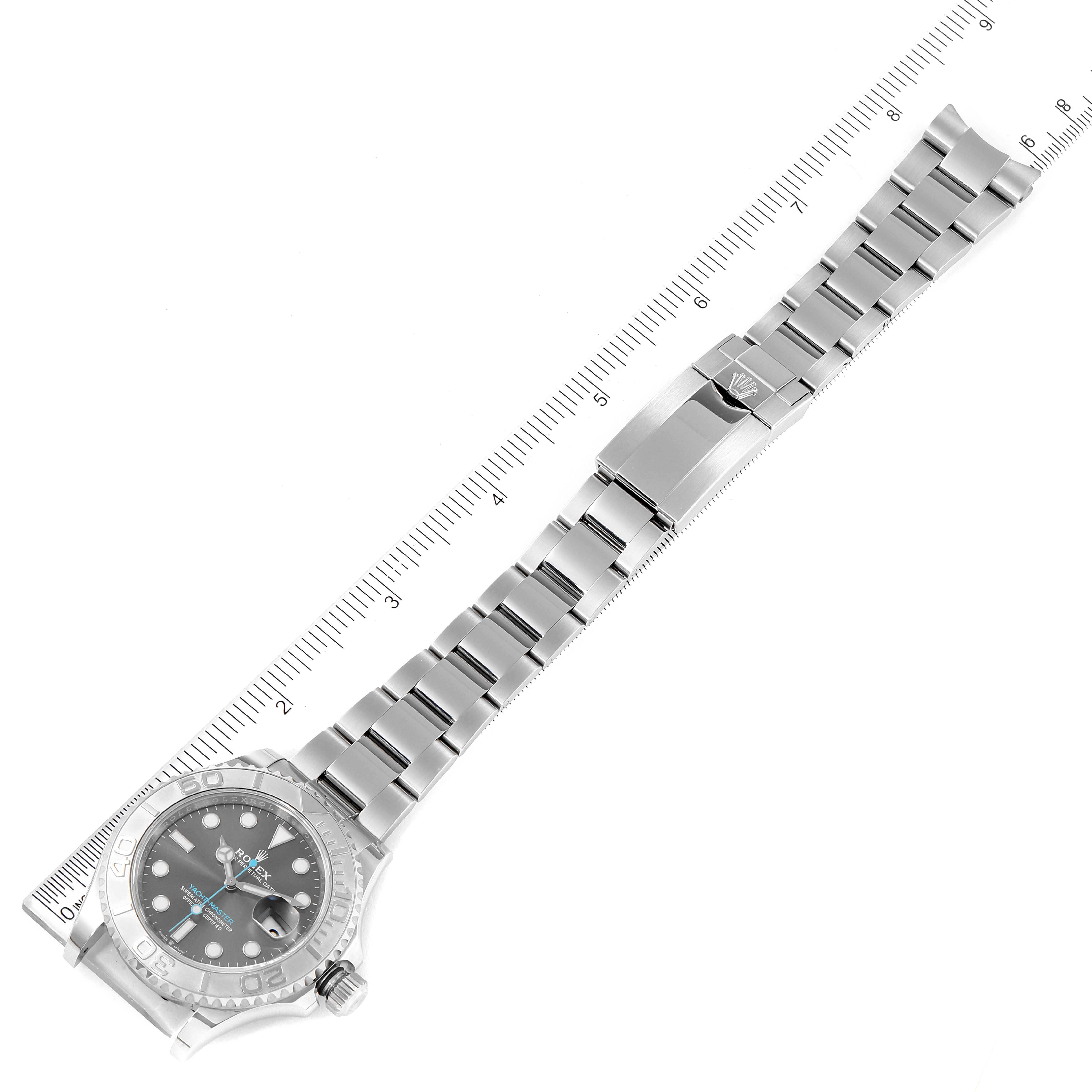 The image shows the front view of a Rolex Yacht-Master 126622 Men's Stainless Steel Grey Dial 126622 Men's Stainless Steel Grey Dial watch with its full bracelet and clasp, positioned alongside a ruler.