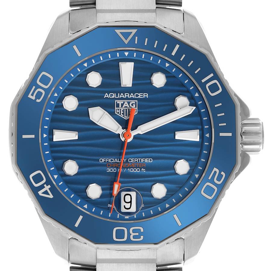 The Tag Heuer Aquaracer watch is shown from the front, displaying the dial, bezel, date window, and part of the bracelet.