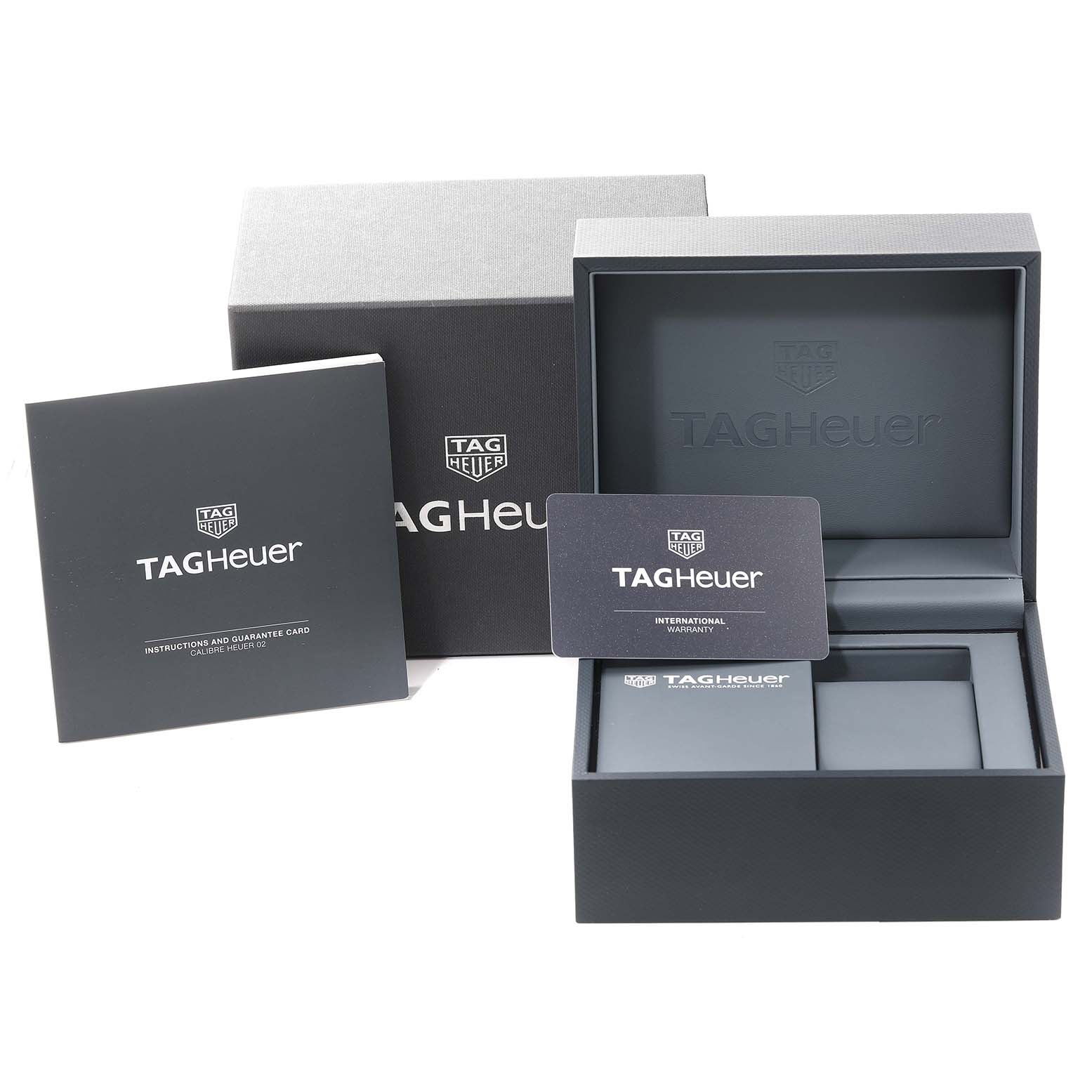 The image shows the packaging, international warranty card, and instruction booklet for a Tag Heuer Carrera CBN2A5A.FC6481 Men
s Steel and Gold (two tone) Black Dial CBN2A5A.FC6481 Men
s Steel and Gold (two tone) Black Dial watch.