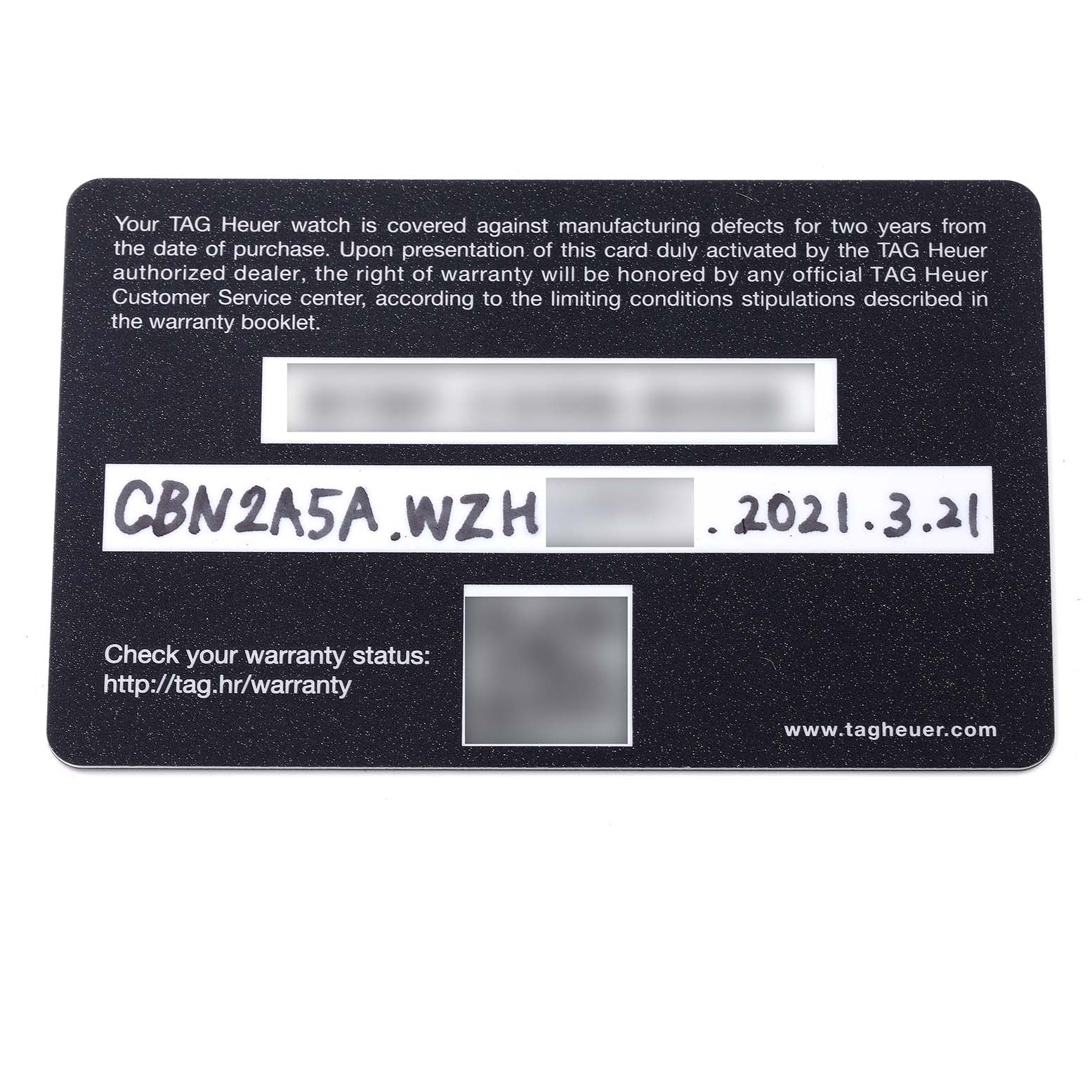 This image shows a close-up of a Tag Heuer Carrera CBN2A5A.FC6481 Men
s Steel and Gold (two tone) Black Dial CBN2A5A.FC6481 Men
s Steel and Gold (two tone) Black Dial warranty card.