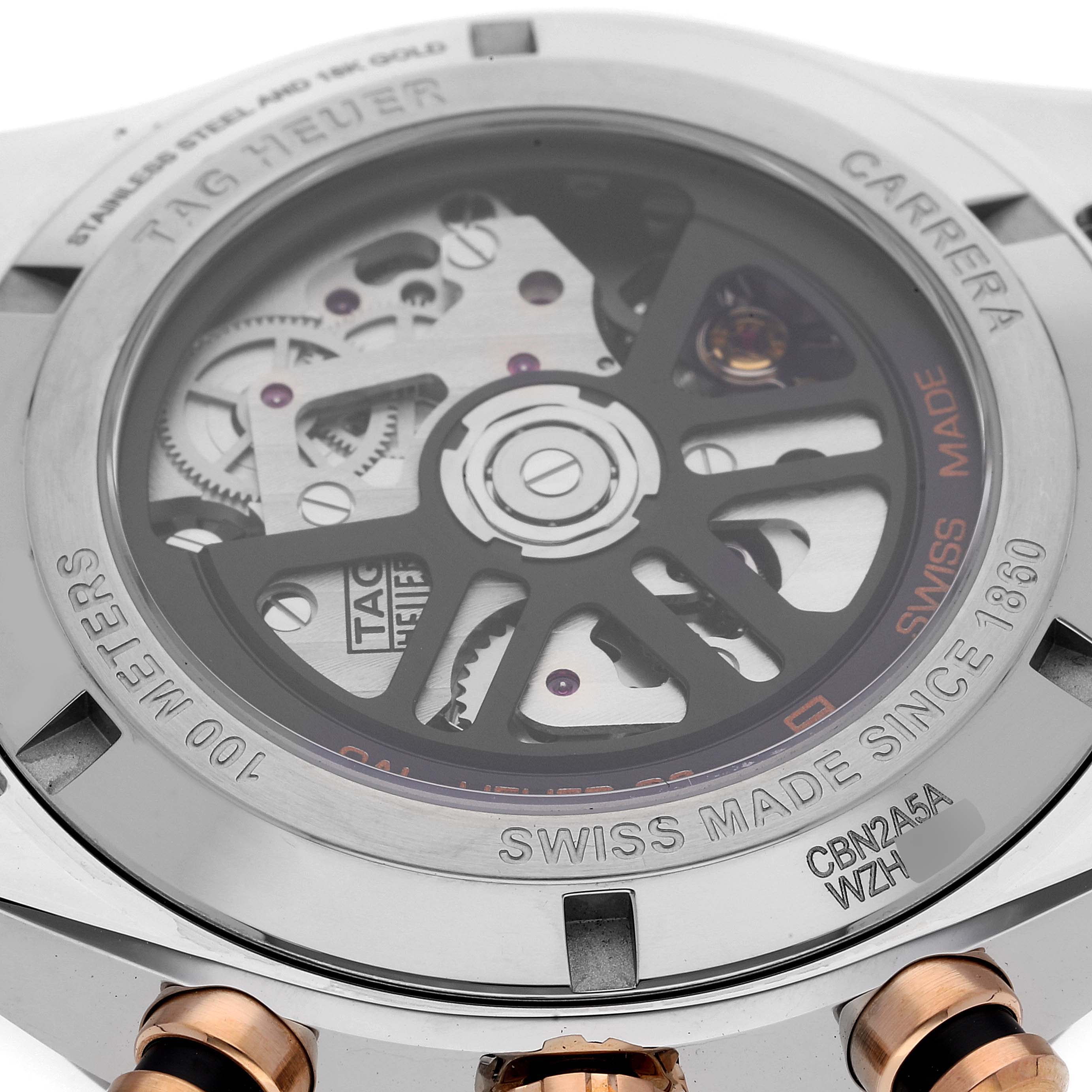 This is a close-up view of the case back of a Tag Heuer Carrera CBN2A5A.FC6481 Men
s Steel and Gold (two tone) Black Dial CBN2A5A.FC6481 Men
s Steel and Gold (two tone) Black Dial watch, showing its mechanical movement and markings.