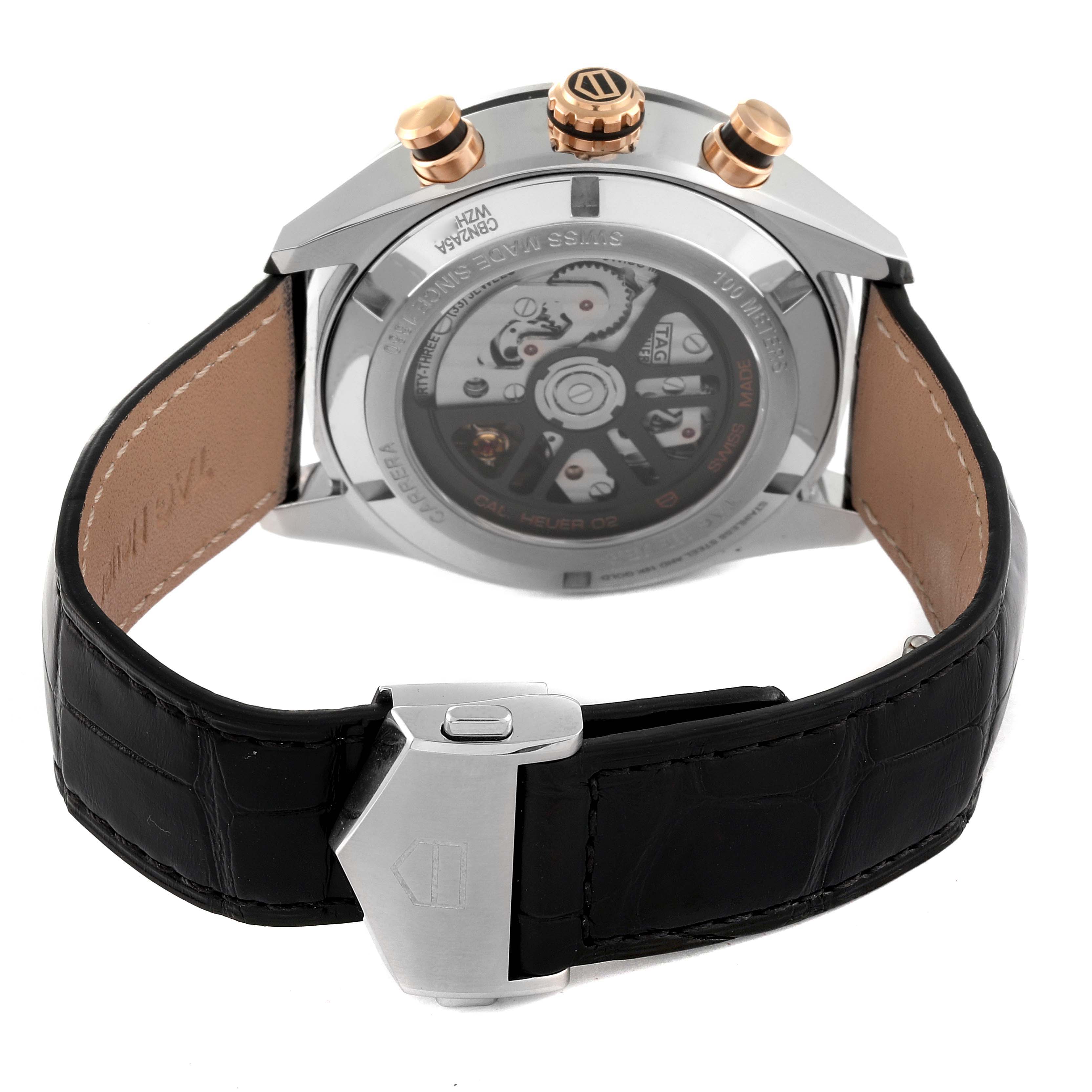 The image shows the back view of the Tag Heuer Carrera CBN2A5A.FC6481 Men
s Steel and Gold (two tone) Black Dial CBN2A5A.FC6481 Men
s Steel and Gold (two tone) Black Dial watch, highlighting its movement, pushers, and leather strap with a deployment clasp.