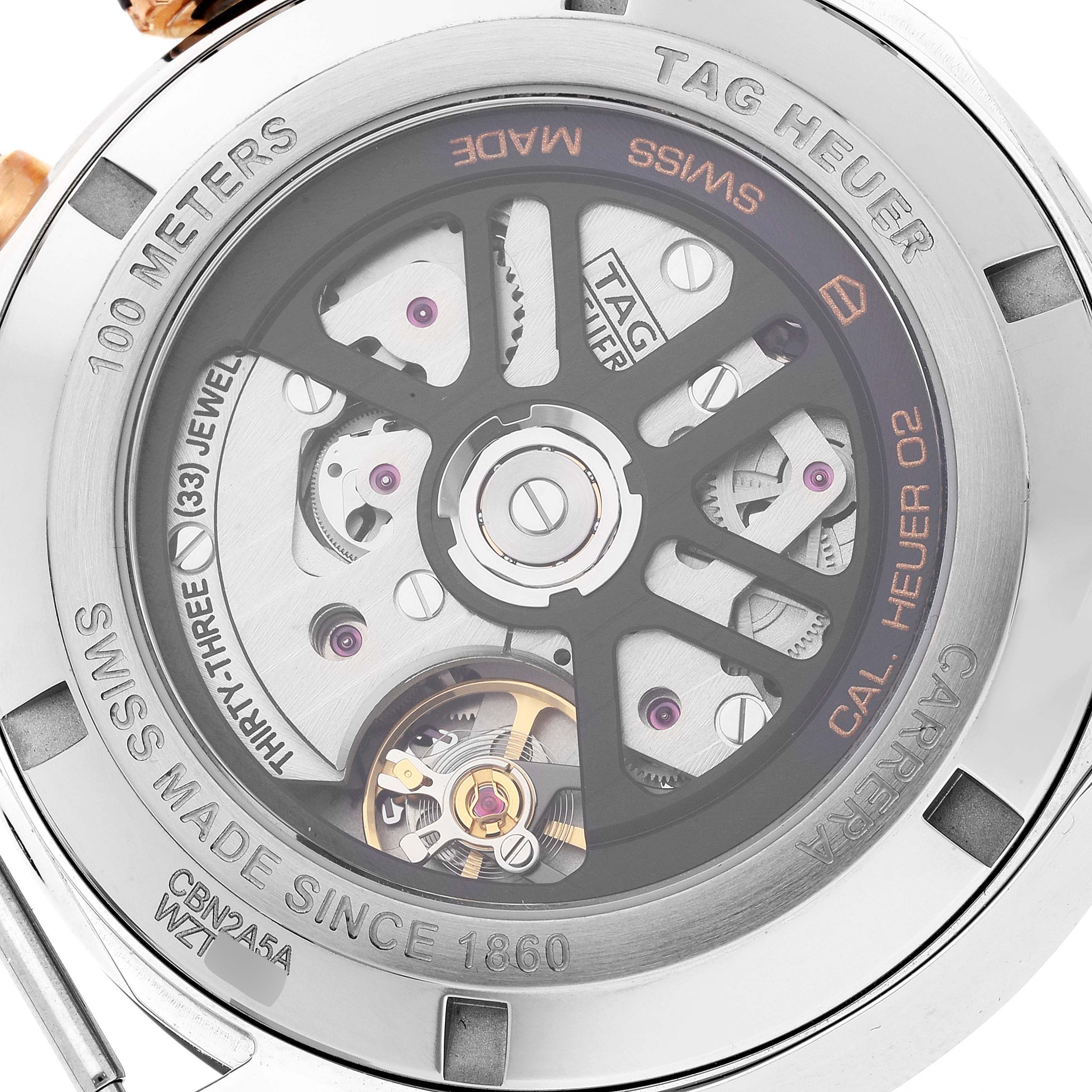 The image shows the back view of a Tag Heuer Carrera CBN2A5A.FC6481 Men
s Steel and Gold (two tone) Black Dial CBN2A5A.FC6481 Men
s Steel and Gold (two tone) Black Dial watch, highlighting its intricate automatic movement mechanism.