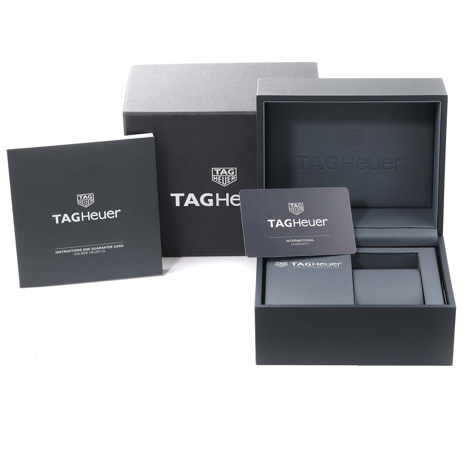 The image shows the packaging, instruction manual, and warranty card for a Tag Heuer Carrera CBN2A5A.FC6481 Men
s Steel and Gold (two tone) Black Dial CBN2A5A.FC6481 Men
s Steel and Gold (two tone) Black Dial watch.