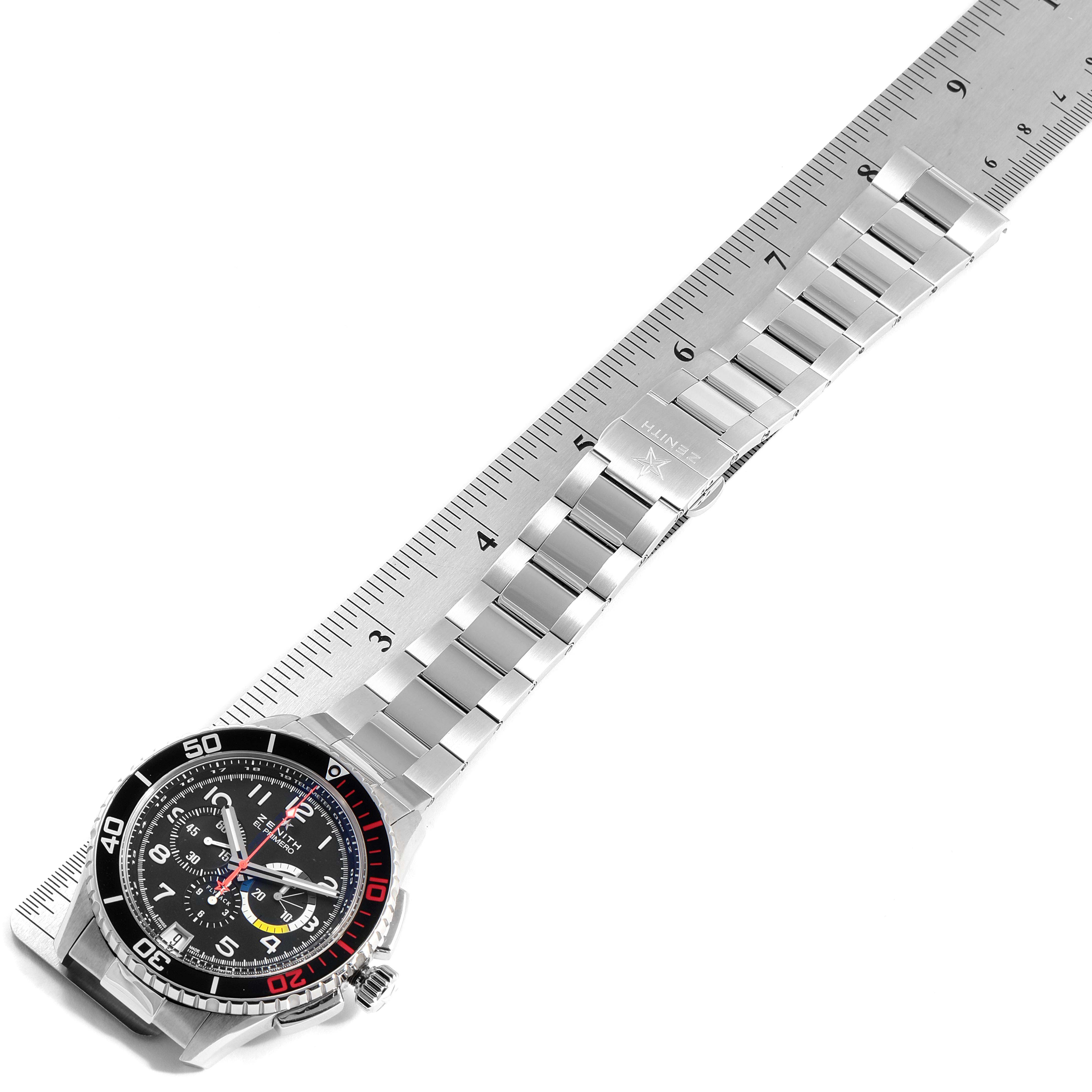 The image shows a Zenith El Primero 03.2061.405/21.M2060  Men's Stainless Steel Black Dial 03.2061.405/21.M2060  Men's Stainless Steel Black Dial watch laid flat with its stainless steel bracelet extended beside a ruler.