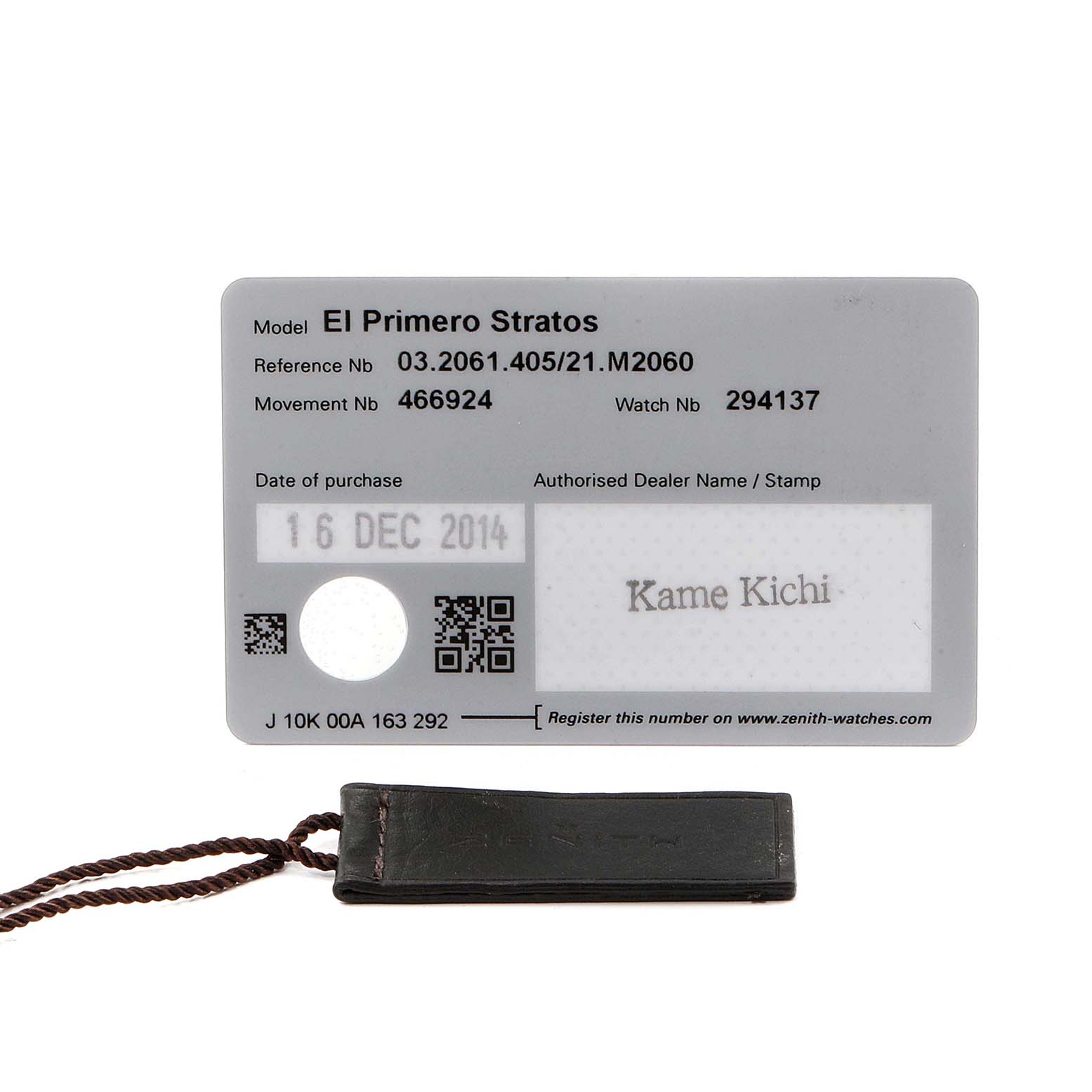 The image shows the warranty card and a tag for the Zenith El Primero 03.2061.405/21.M2060  Men's Stainless Steel Black Dial 03.2061.405/21.M2060  Men's Stainless Steel Black Dial Stratos watch.