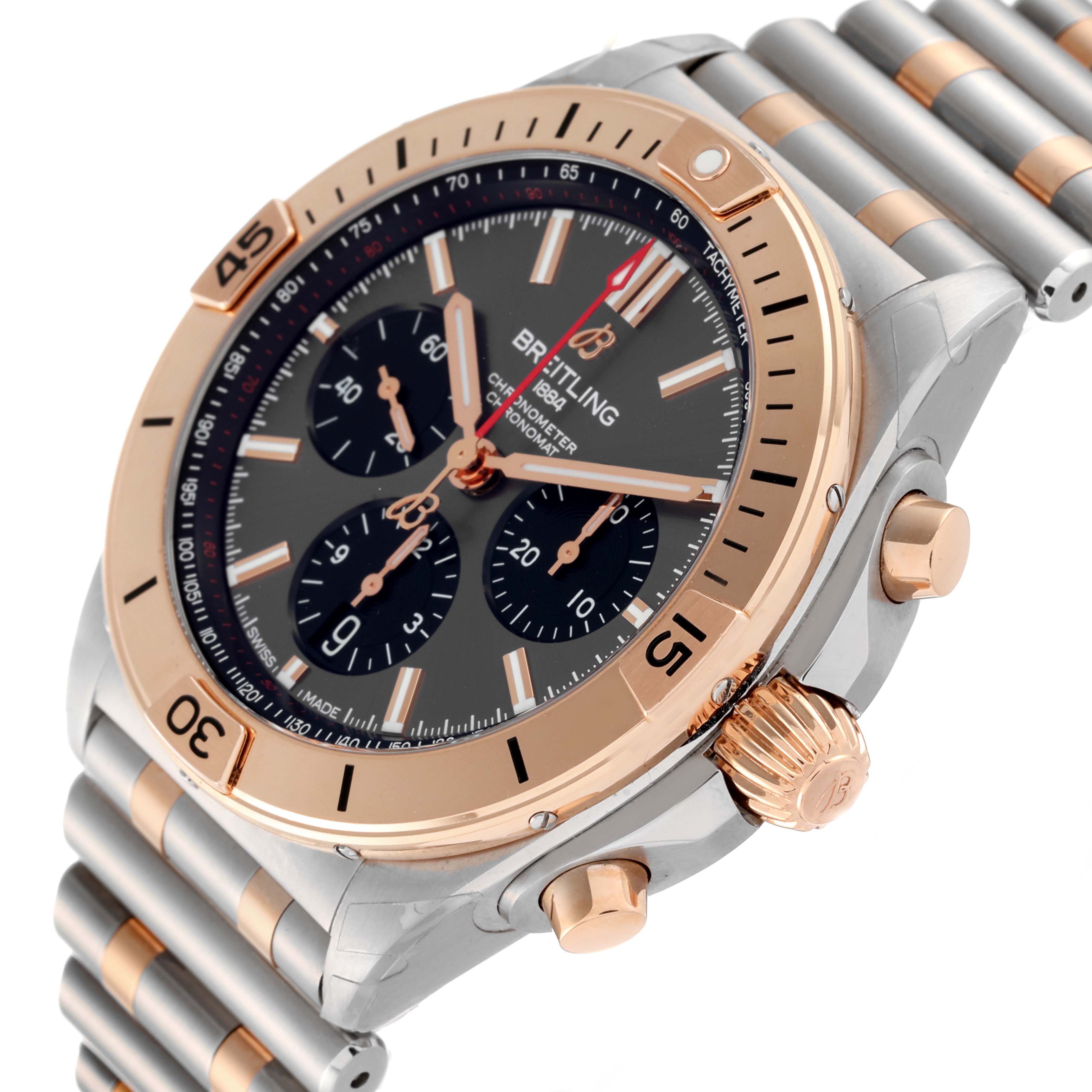 The image shows a side angle of a Breitling Chronomat UB0134 Men's Steel and Gold (two tone) Grey Dial UB0134 Men's Steel and Gold (two tone) Grey Dial watch, highlighting the bezel, crown, pushers, and part of the bracelet.