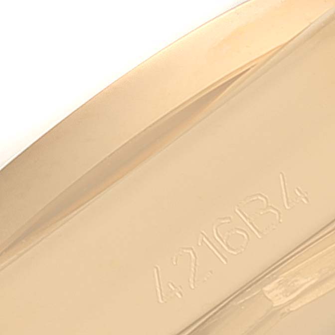 The image shows a close-up of the engraved serial number on the 18k rose gold case of the Breitling H72348 Women's Rose Gold Black Dial H72348 Women's Rose Gold Black Dial Galactic 29 Ladies Watch model H72348.