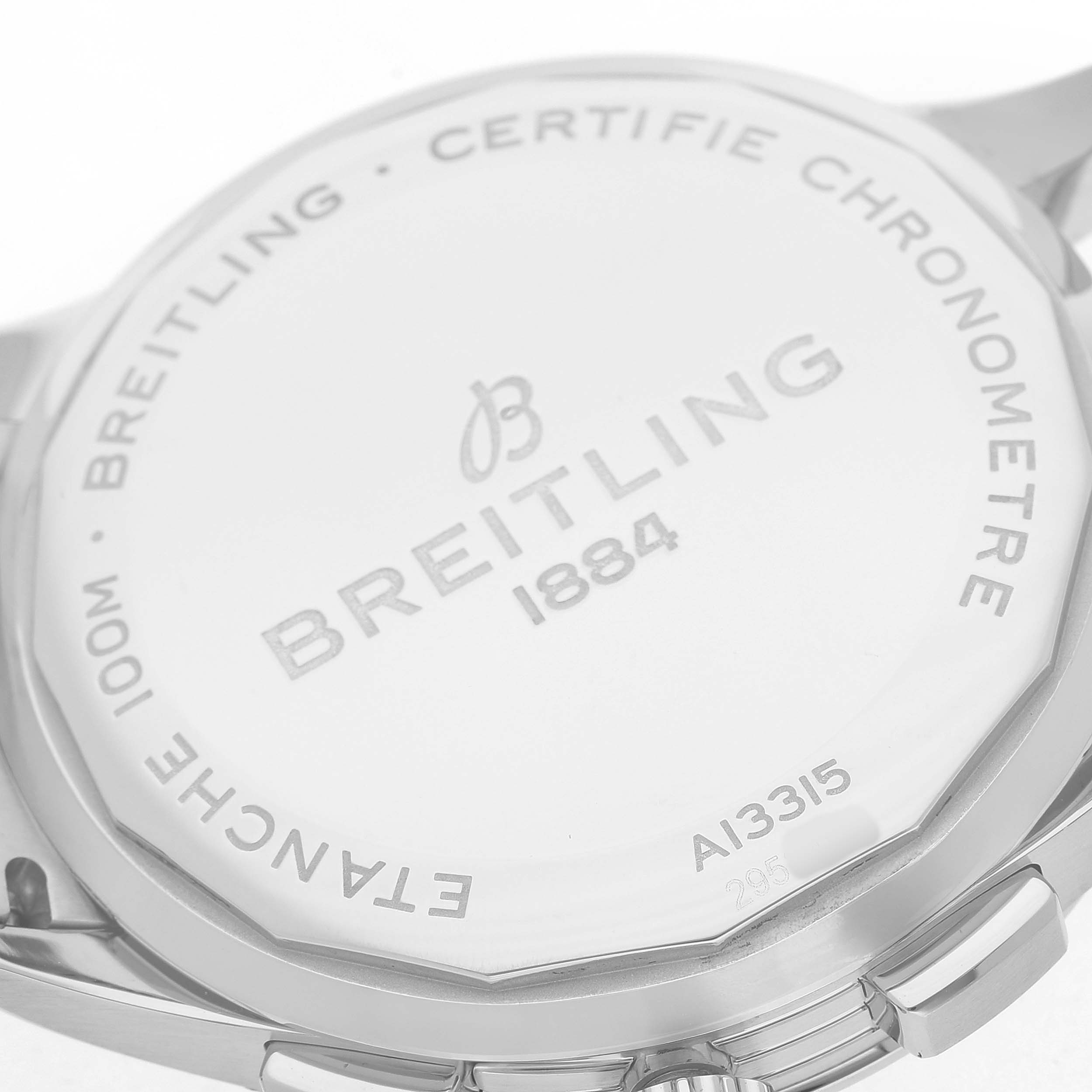 The image shows the back case of a Breitling Premier A13315 Men's Stainless Steel Black Dial watch, featuring the brand name and model details engraved.
