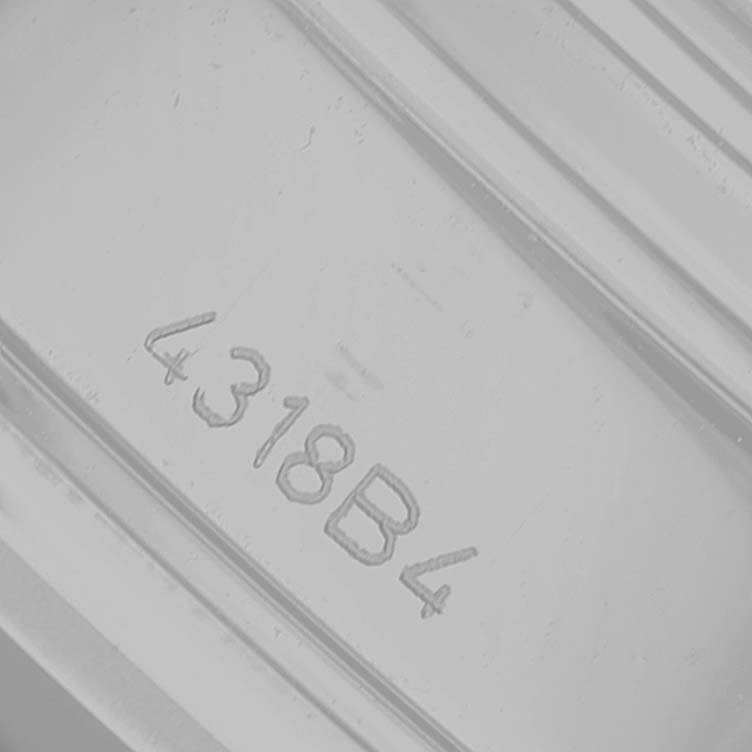 The image shows a close-up of the serial number engraving on the back of the Breitling Premier A13315 Men's Stainless Steel Black Dial watch.