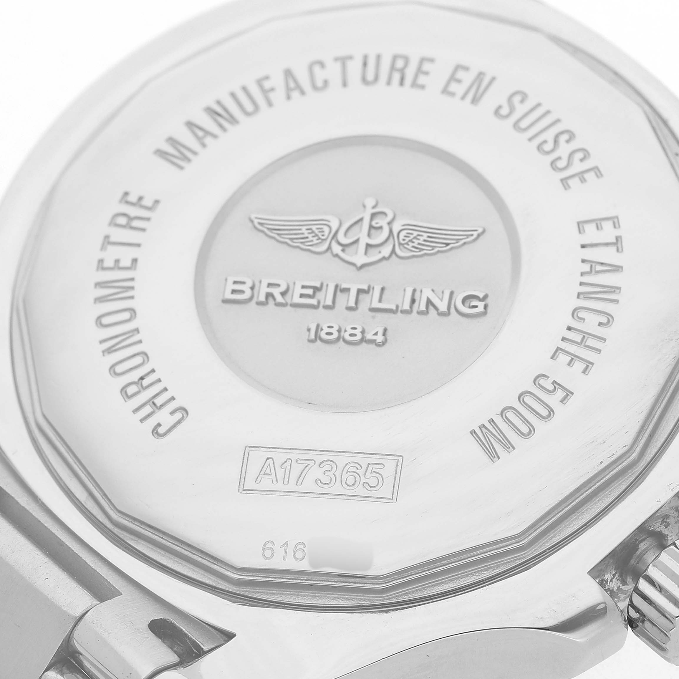 The image shows the back of a Breitling Superocean A17365 Men's Stainless Steel Black Dial watch, highlighting the engraved case and crown.