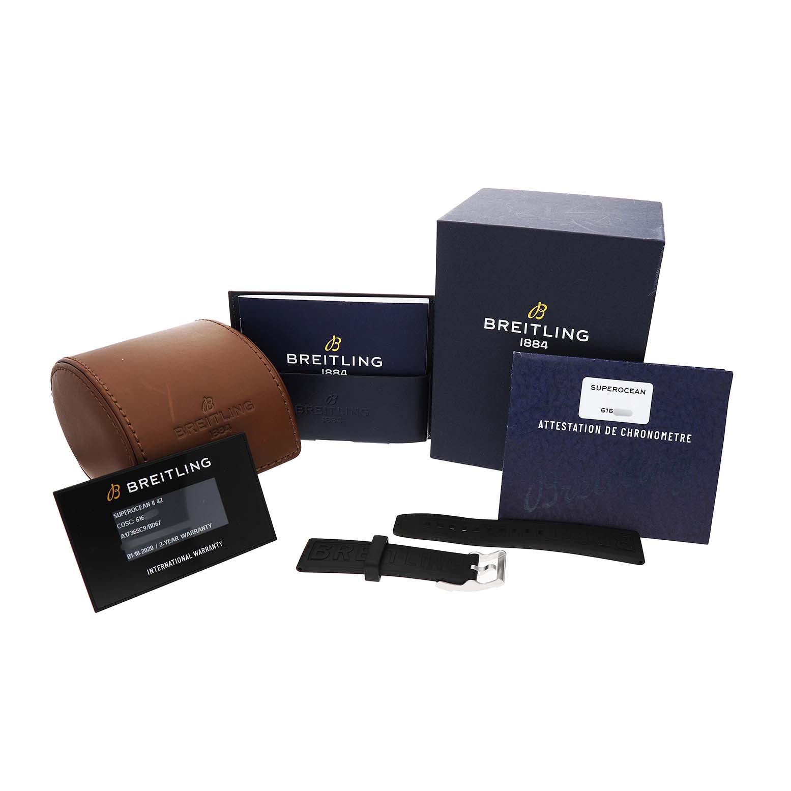 The image shows Breitling Superocean A17365 Men's Stainless Steel Black Dial packaging, including a box, leather case, warranty card, documents, and a strap.