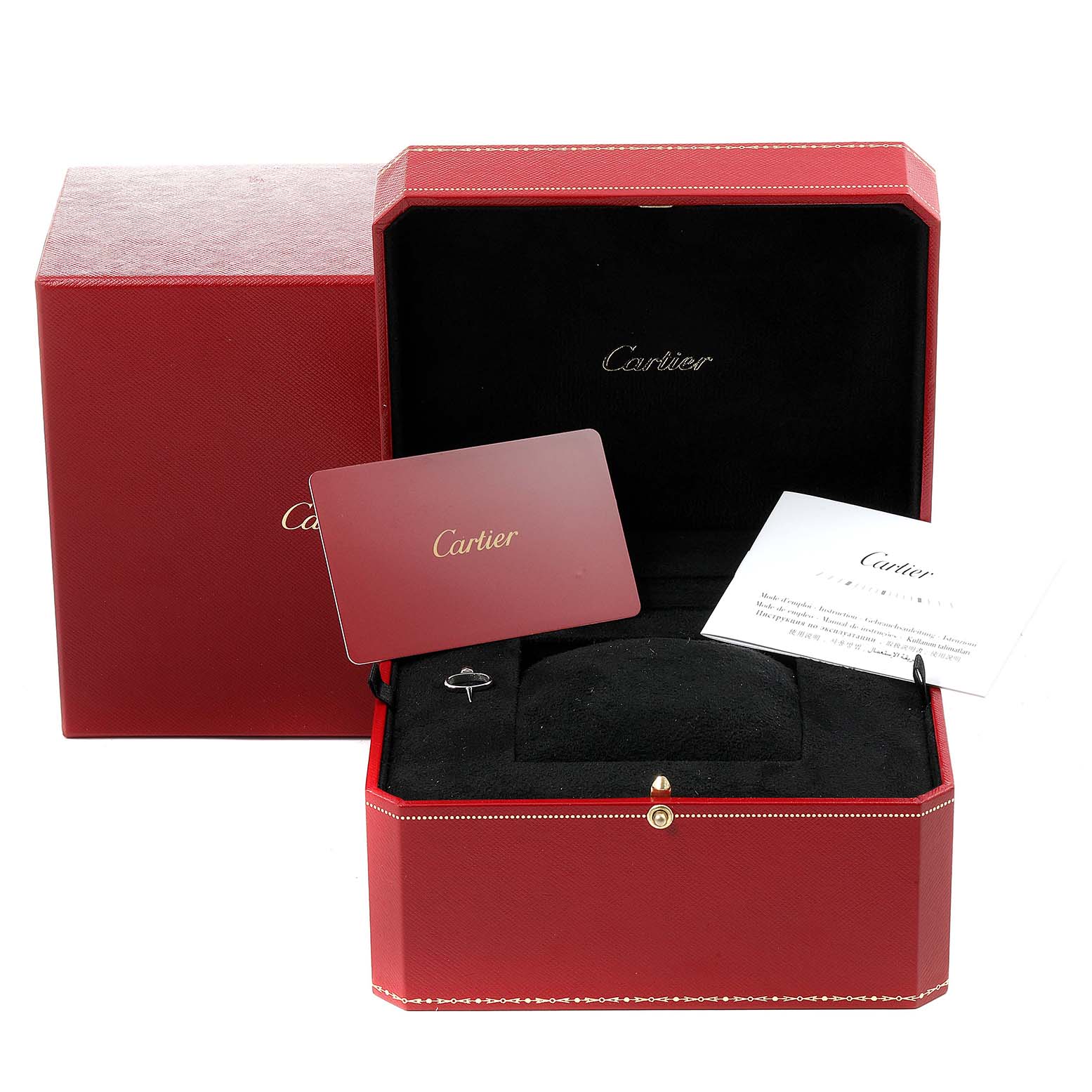The image shows the Drive de Cartier watch presentation box, guarantee card, and related accessories by Cartier.