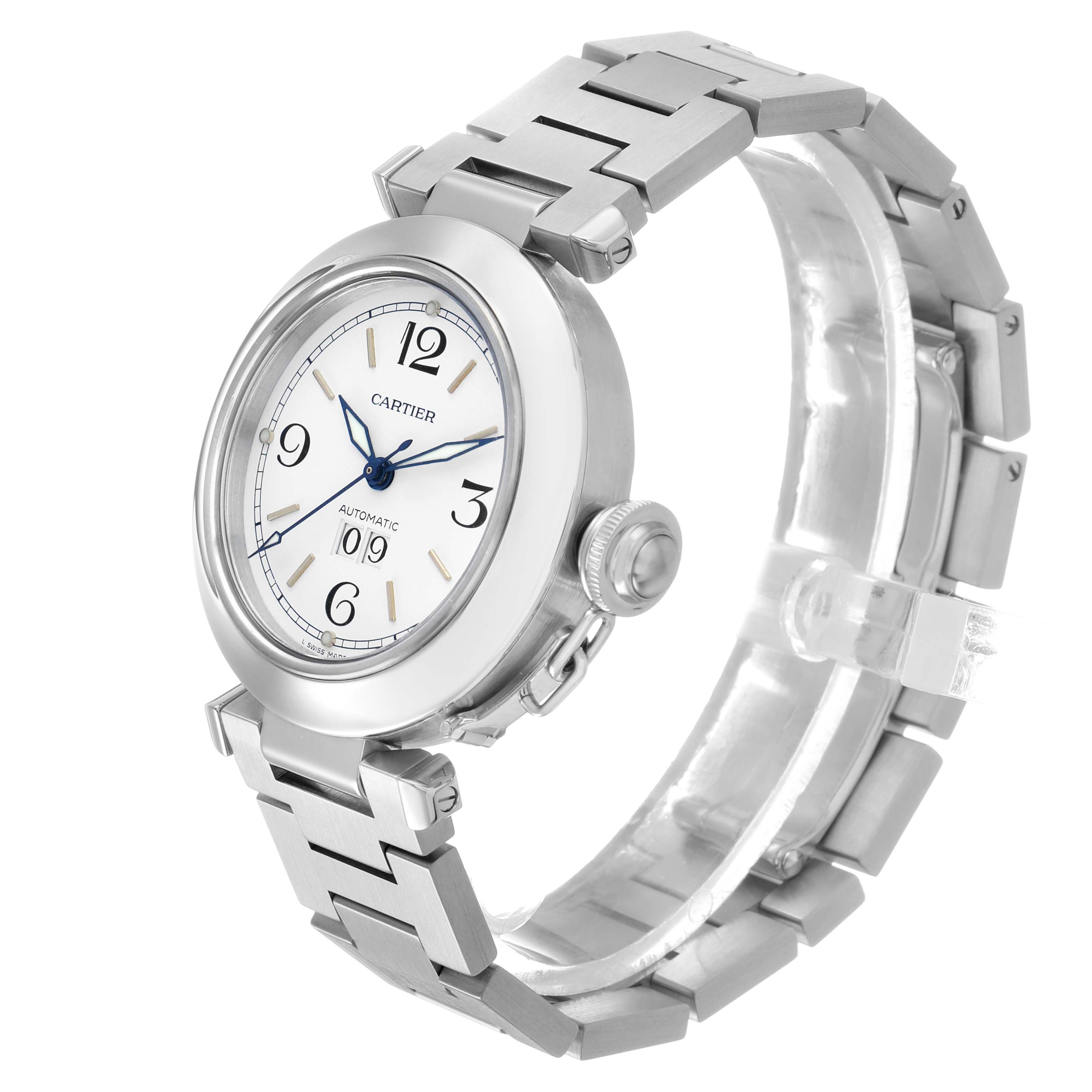 The Cartier Pasha W31044M7 Men's Stainless Steel White Dial watch is shown at a three-quarter angle, highlighting its face, bezel, bracelet, and crown.
