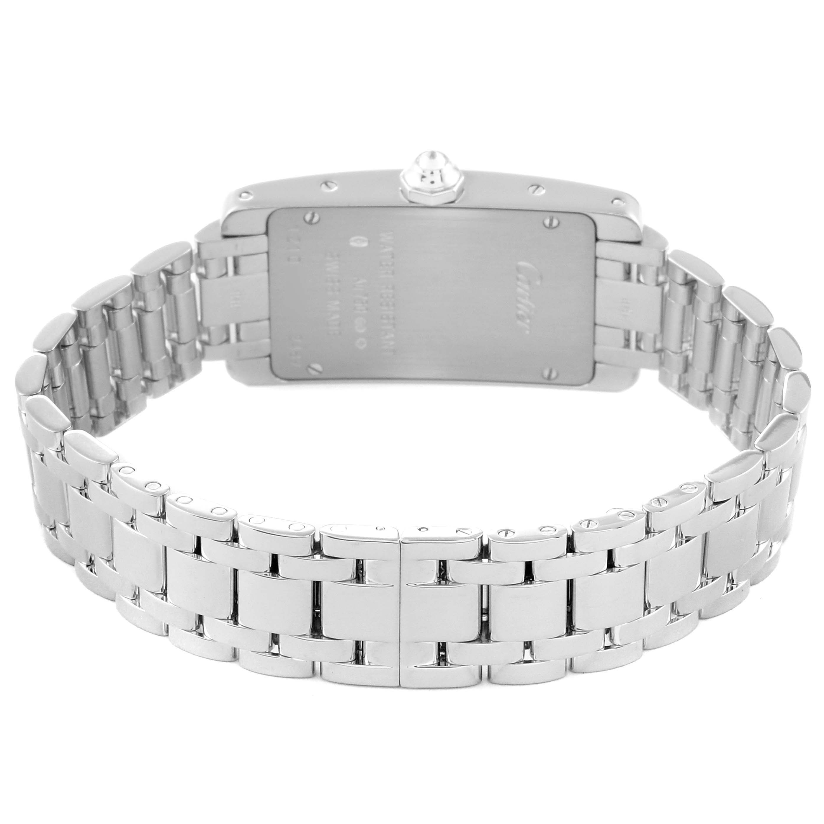 The image shows the back view of the Tank Americaine model by Cartier, showcasing its metal bracelet and case back.