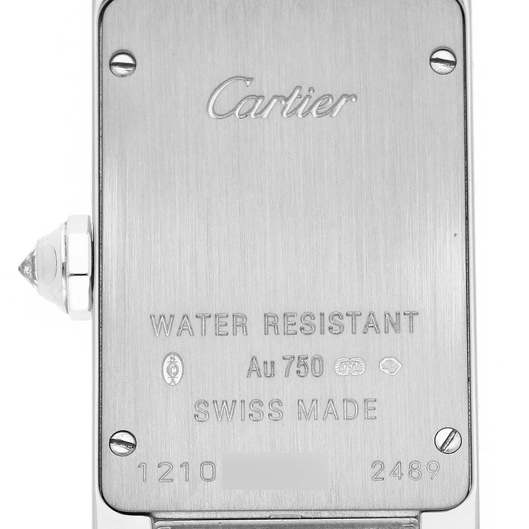 This image shows the back of a Cartier Tank Americaine WB7073L1 Women
s White Gold Silver Dial WB7073L1 Women
s White Gold Silver Dial watch, displaying its water resistance, material, and serial numbers.