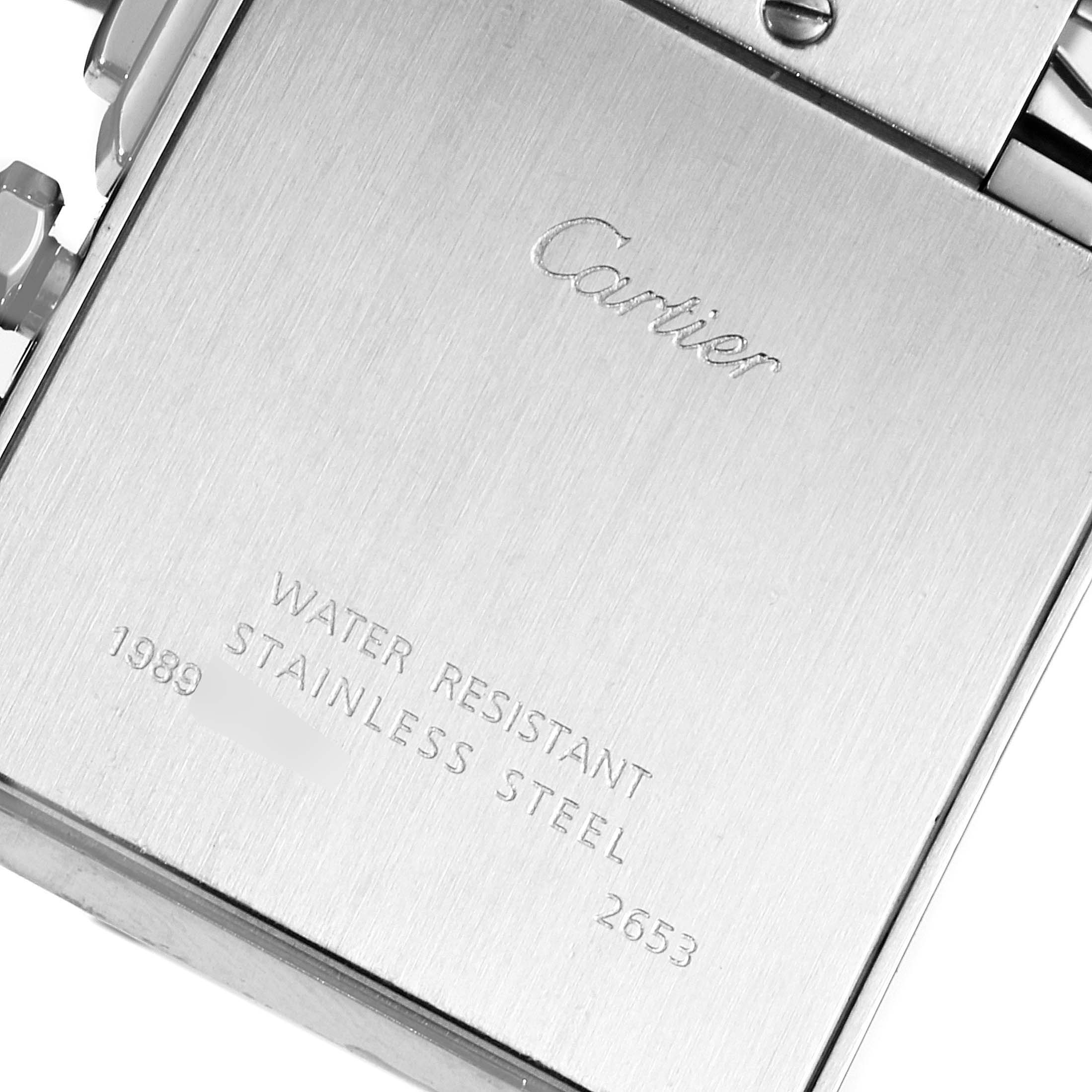 The image shows the back case of a Cartier Tank Francaise W51024Q3 Men's Stainless Steel Silver Dial W51024Q3 Men's Stainless Steel Silver Dial watch, including engravings and part of the strap.