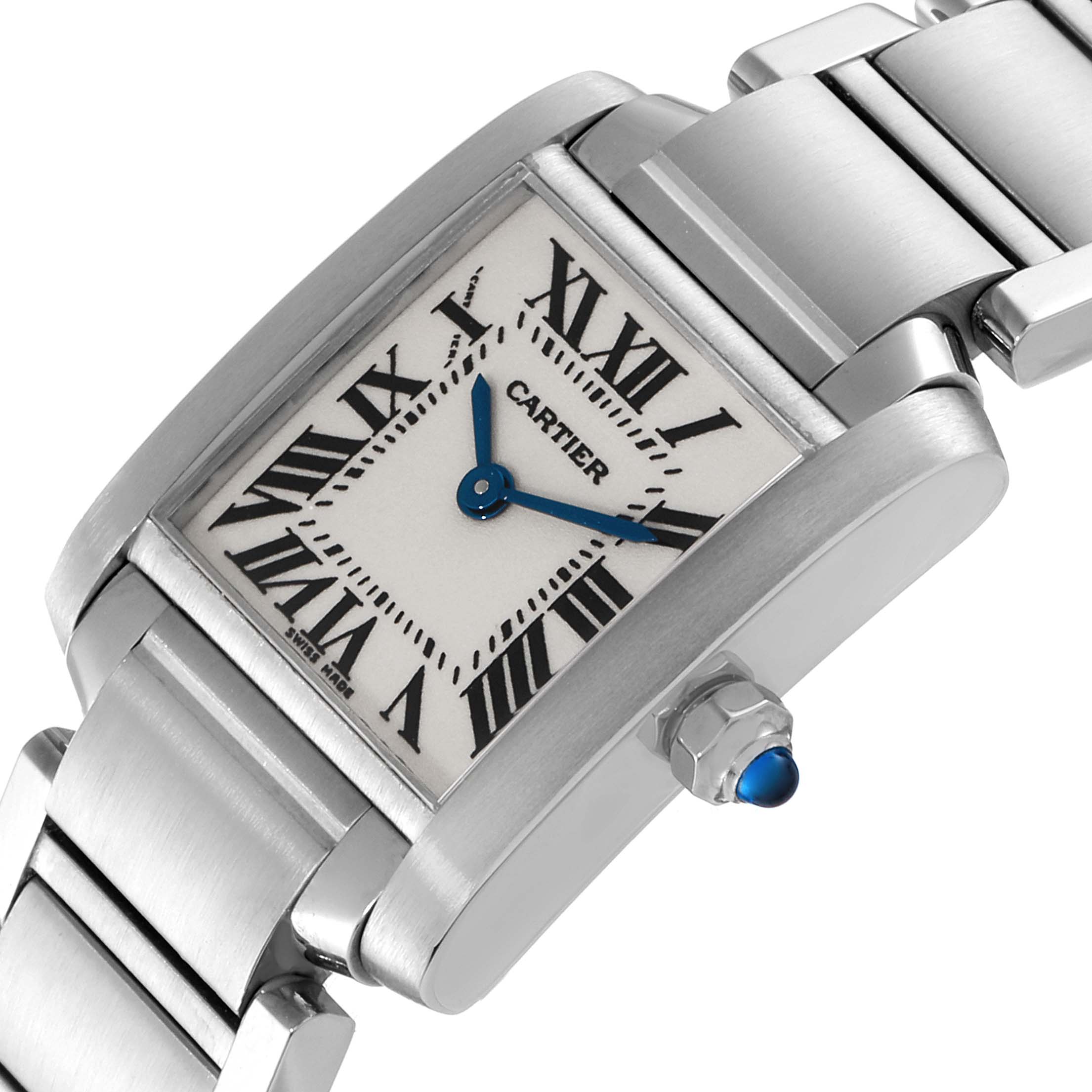 The Cartier Tank Francaise W51008Q3 Women
s Stainless Steel Silver Dial W51008Q3 Women
s Stainless Steel Silver Dial watch is shown at an angle highlighting the face, bezel, bracelet, and crown with a blue cabochon.