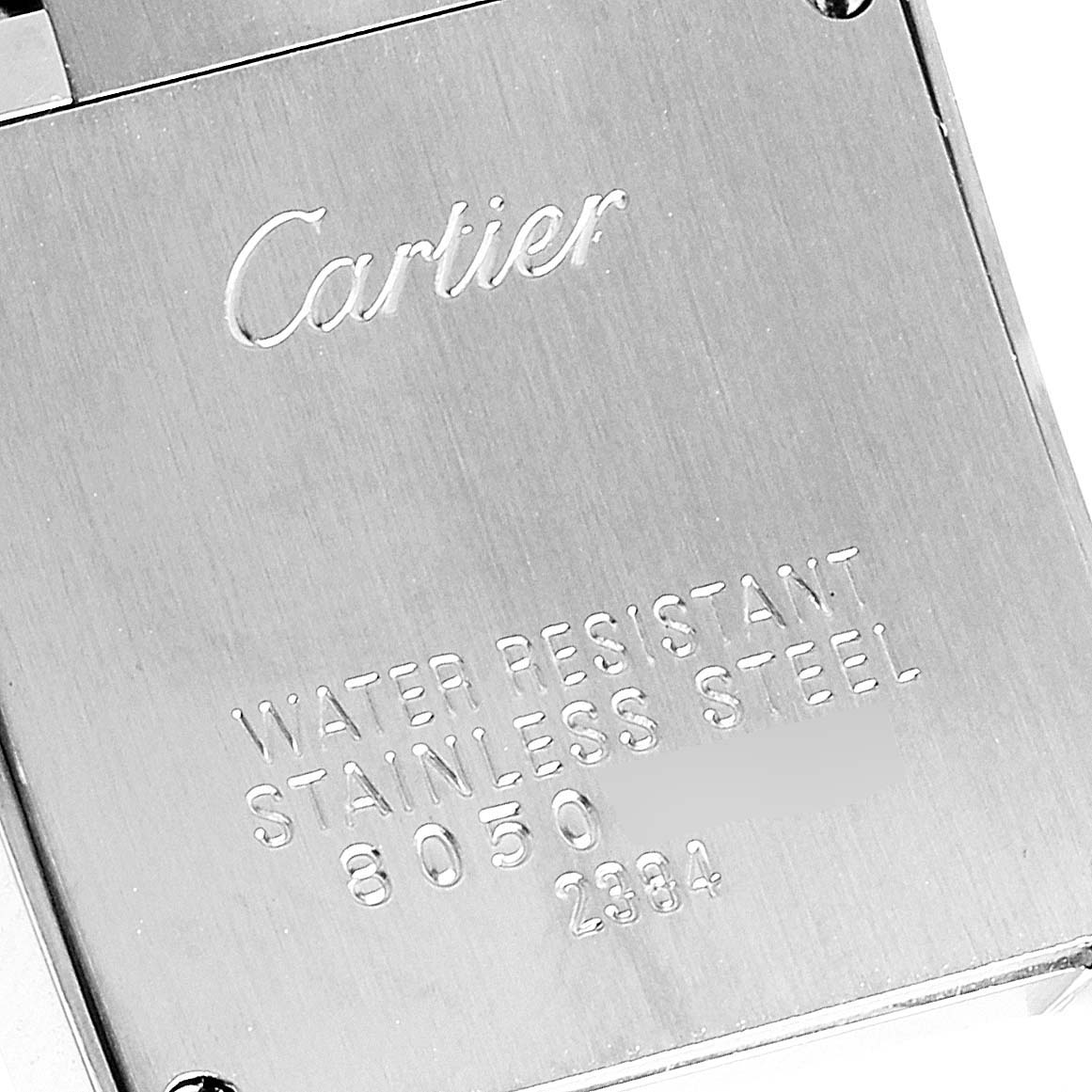 This image shows the back case of a Cartier Tank Française watch, featuring engraved model details and the Cartier logo.