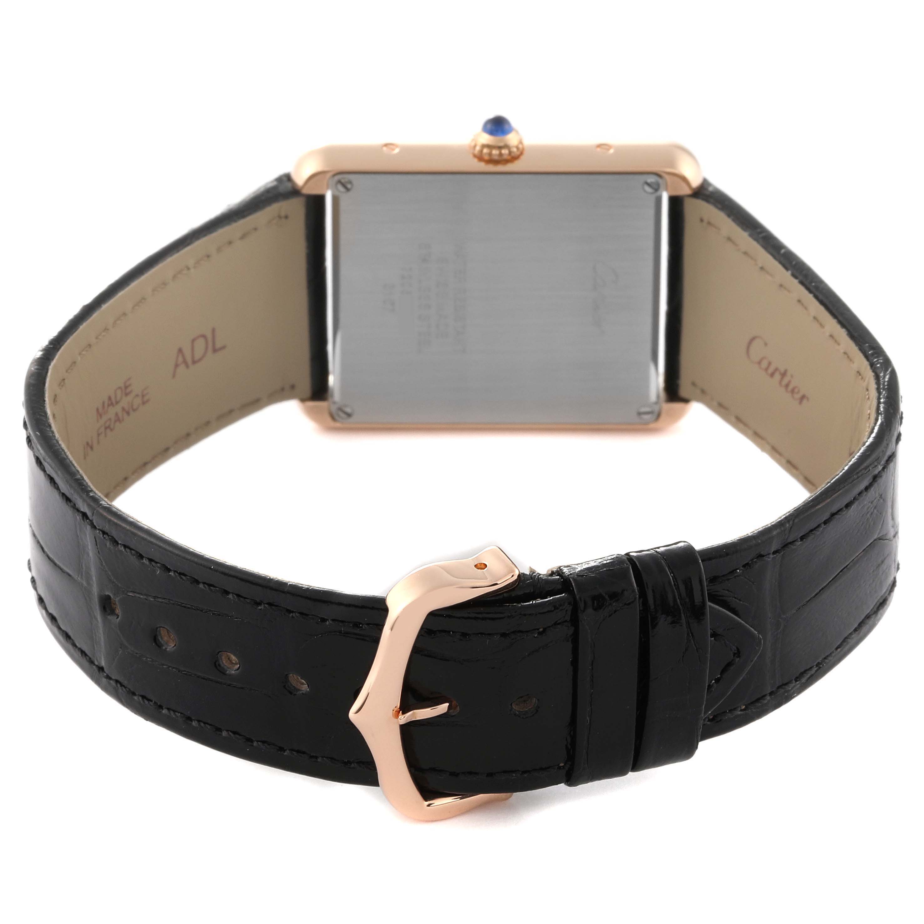 The image shows the back view of the Cartier Tank Solo W5200025 Men's Steel and Gold (two tone) Silver Dial W5200025 Men's Steel and Gold (two tone) Silver Dial watch, highlighting its case back, leather strap, and buckle.