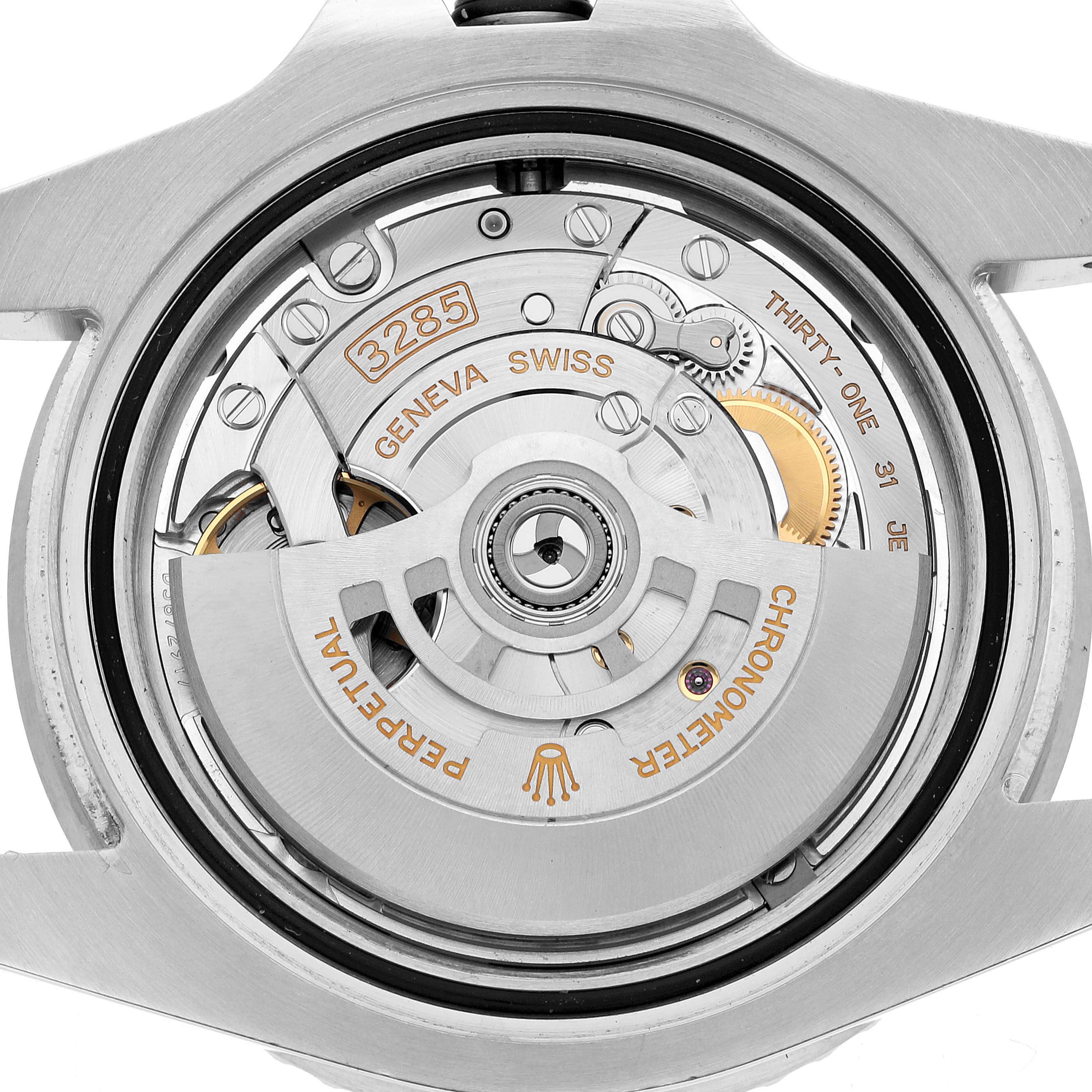 The image shows the movement of a Rolex GMT-Master 126710BLNR Men's Stainless Steel Black Dial, focusing on its intricate mechanical components from a back view.