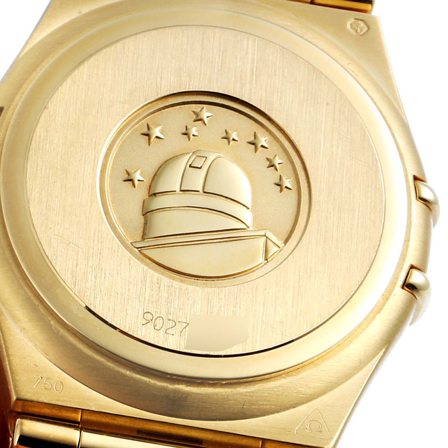 The image shows the back case of the Omega 1177.79.00 Women's White Gold Mother of Pearl Dial 1177.79.00 Women's White Gold Mother of Pearl Dial Constellation Iris Yellow Gold Multi Stone Watch 1177.79.00 with an embossed observatory logo.