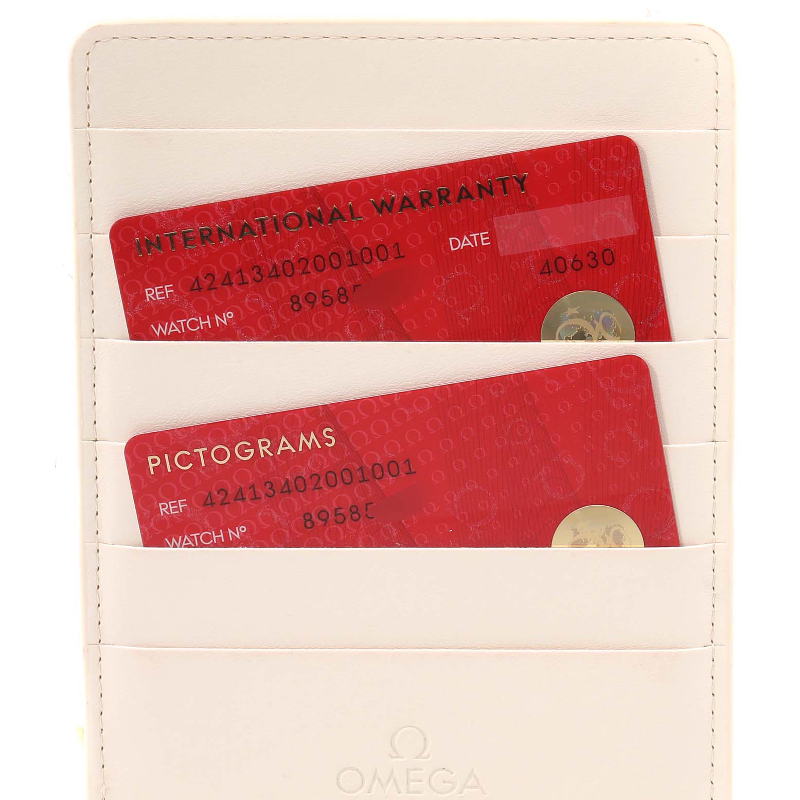 The image shows a close-up of the international warranty and pictograms cards for the Omega De Ville 424.13.40.20.01.001 Men's Stainless Steel Black Dial 424.13.40.20.01.001 Men's Stainless Steel Black Dial watch.